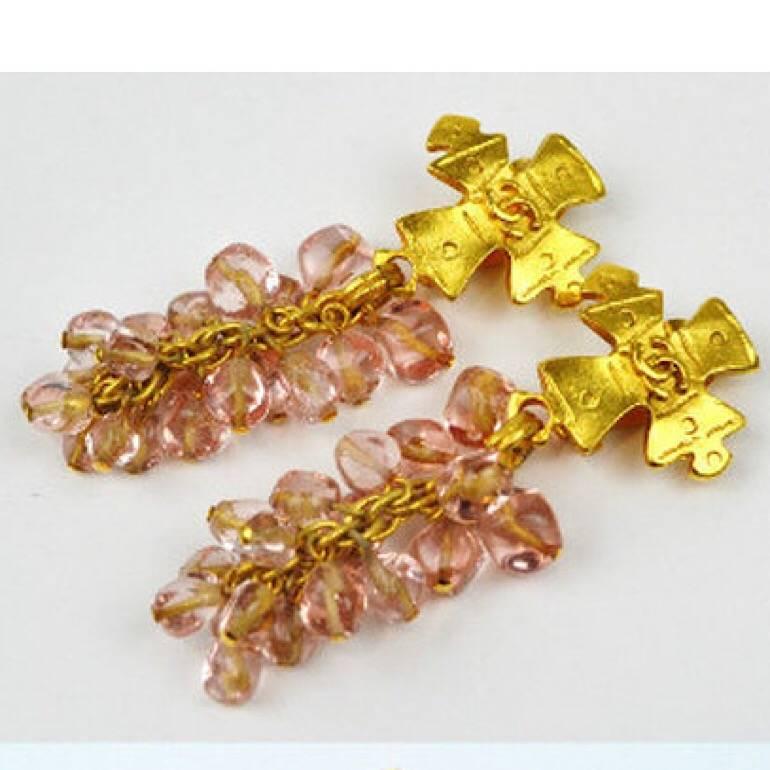 1990s. Vintage Chanel rare cross CC motif and pink color stone grape design dangling earrings. One-of-a-kind vintage Chanel jewelry piece.

Here is another rare and excellent beauty from Chanel.
Beautiful pink grapes!
On top of that, it features