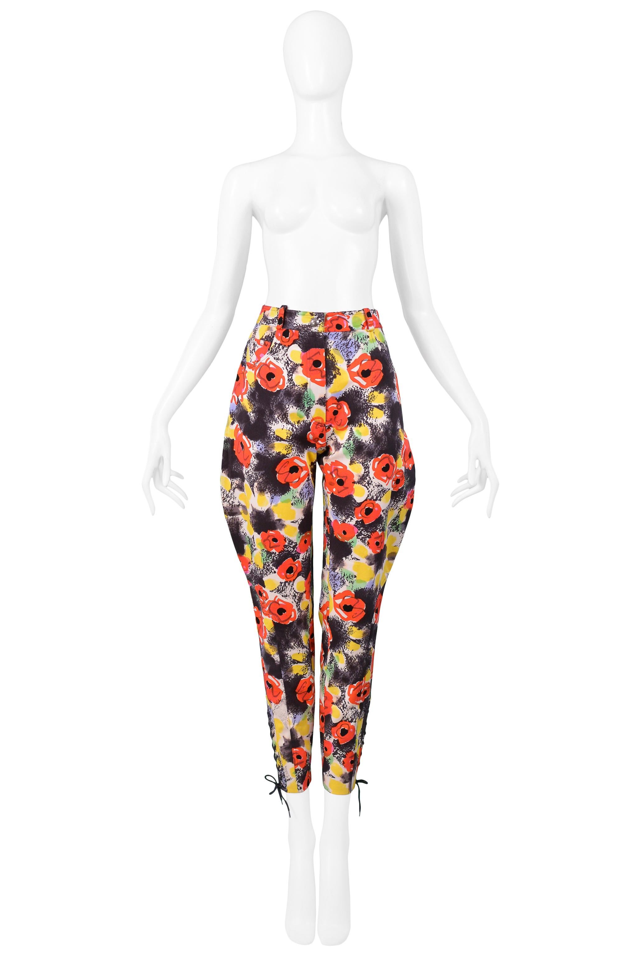 Resurrection Vintage is excited to offer a vintage Chanel by Karl Lagerfeld black, red, and yellow cotton floral print jodhpur capri pants, featuring a high waist, corset laces at the ankles, and front fly zipper. From the 1997 Chanel runway