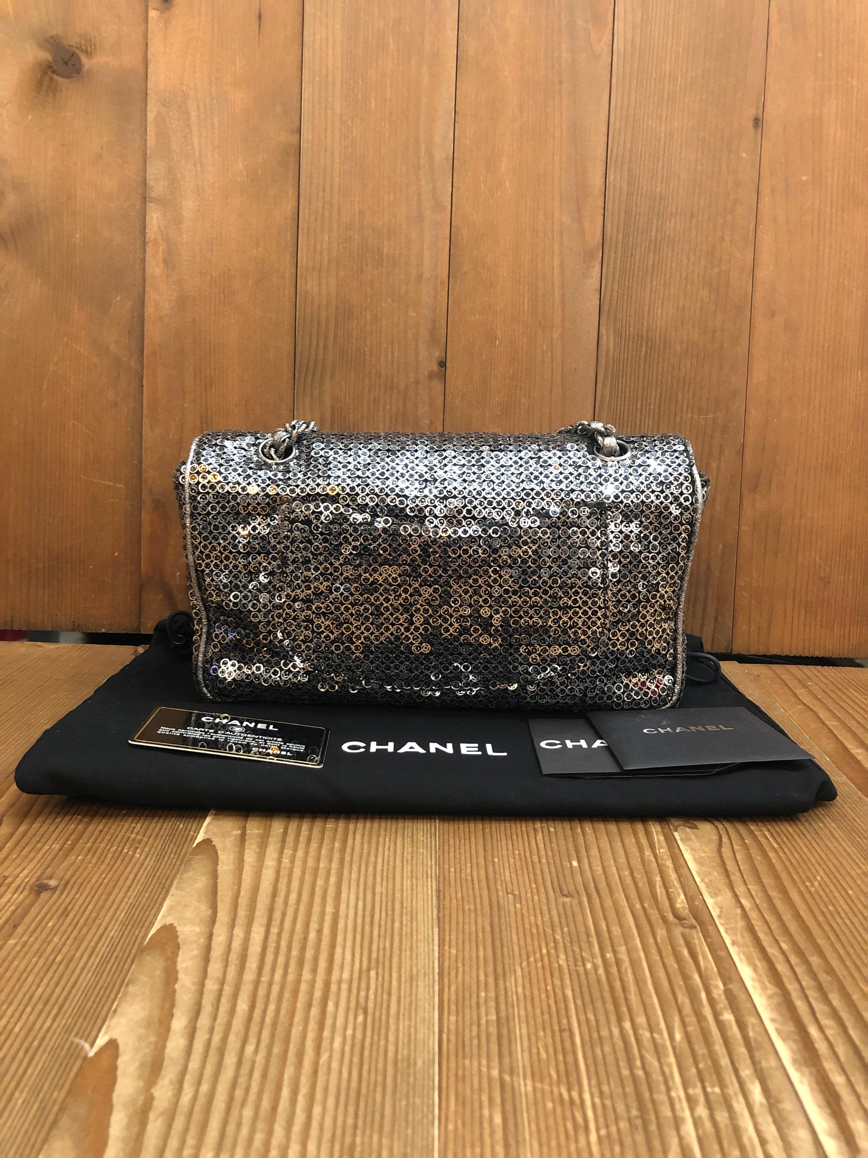 This CHANEL flap bag is crafted of handsewn silver sequins featuring silver toned hardware. Front flap CC turn-lock closure opens to a black fabric interior with a zippered and a patch pocket. This flap bag also features a patch pocket at the back.