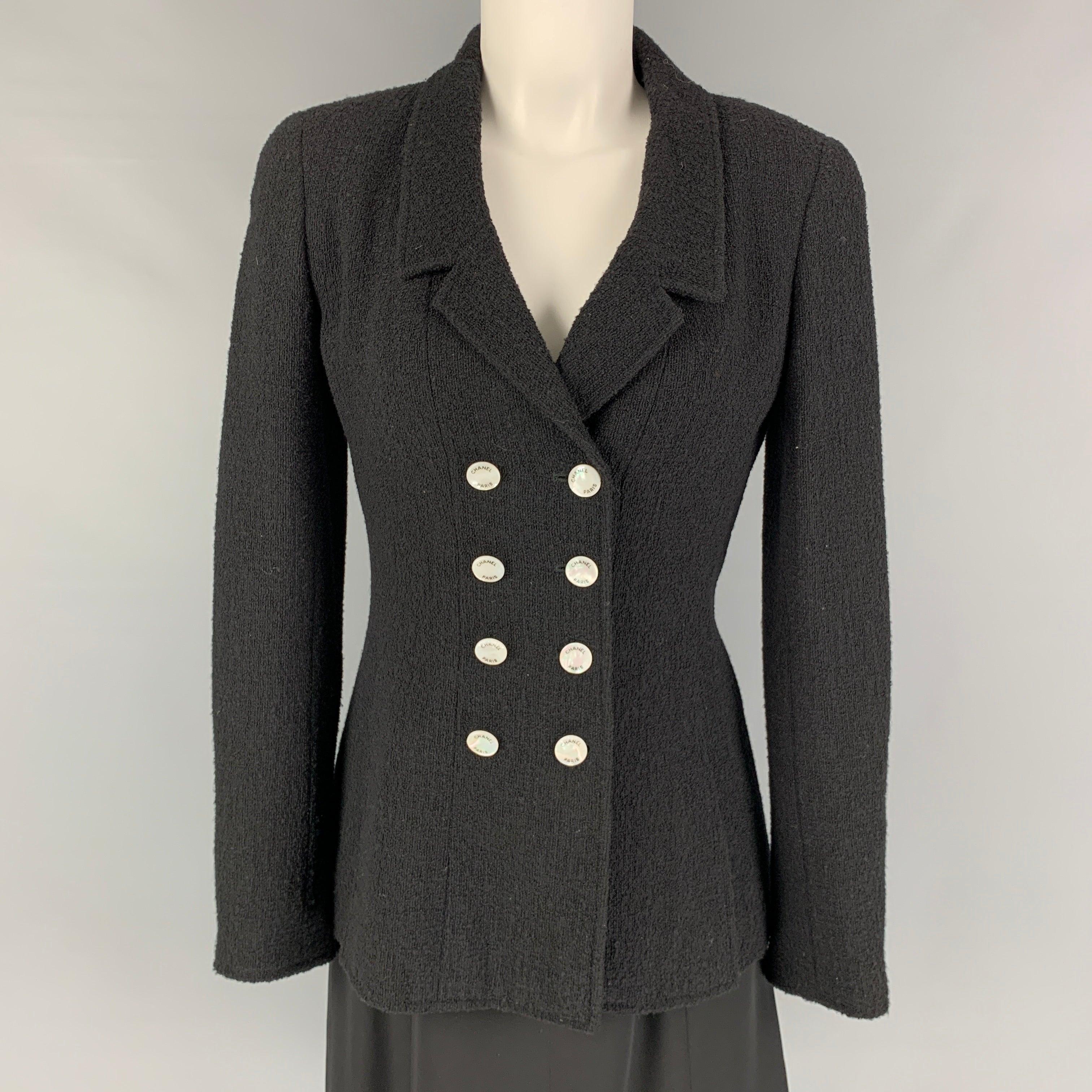 Vintage CHANEL set comes in a black textured wool / nylon featuring an a-line style dress, sleeveless, textured straps, back zip up closure and a matching double breasted jacket. Made in France.
Very Good
Pre-Owned Condition. 

Marked:   FR 38