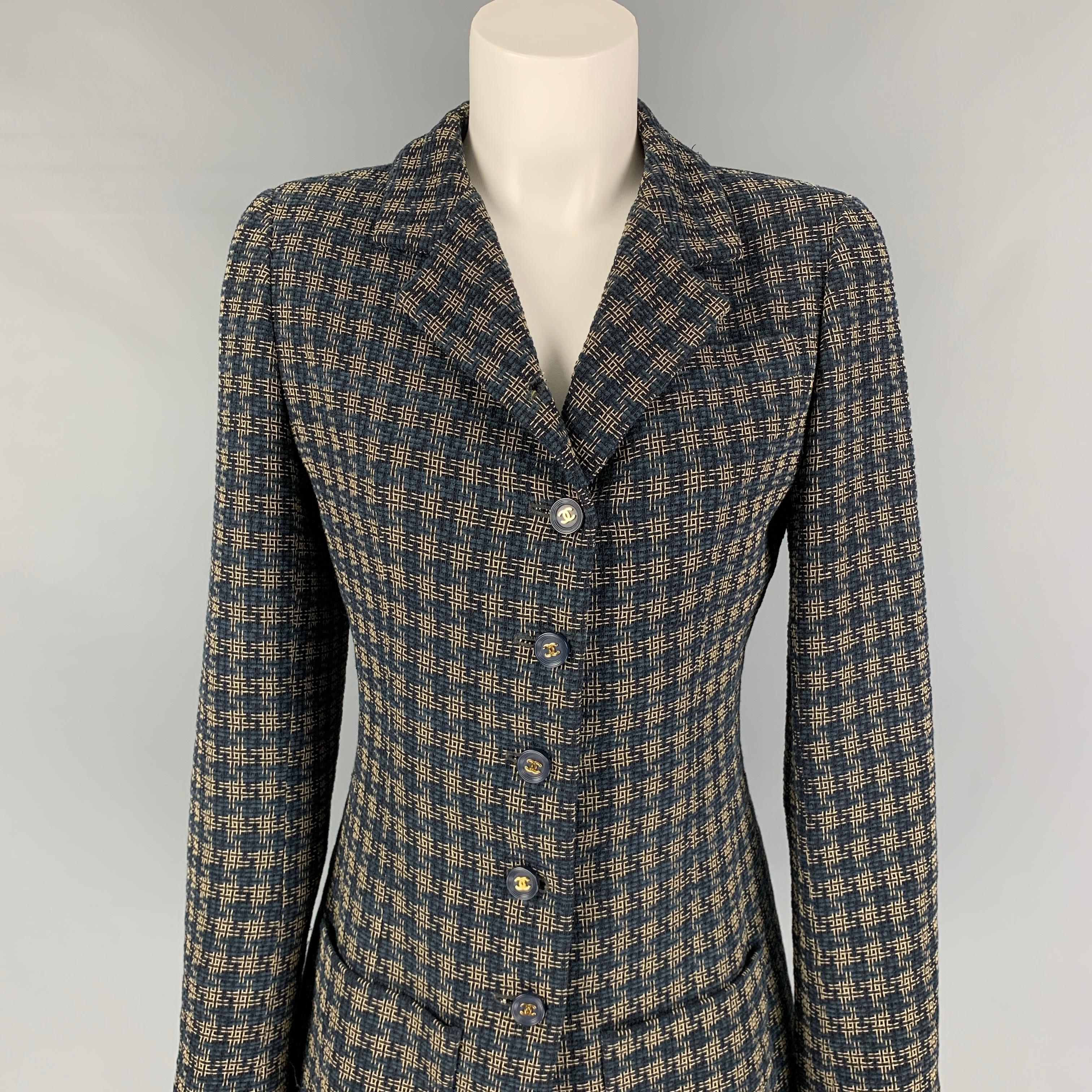 Vintage CHANEL jacket comes in a navy & cream checkered wool blend with a full liner featuring a notch lapel, patch pockets, chanel logo buttons, and a buttoned closure. Made in France. 

Very Good Pre-Owned Condition.
Marked: