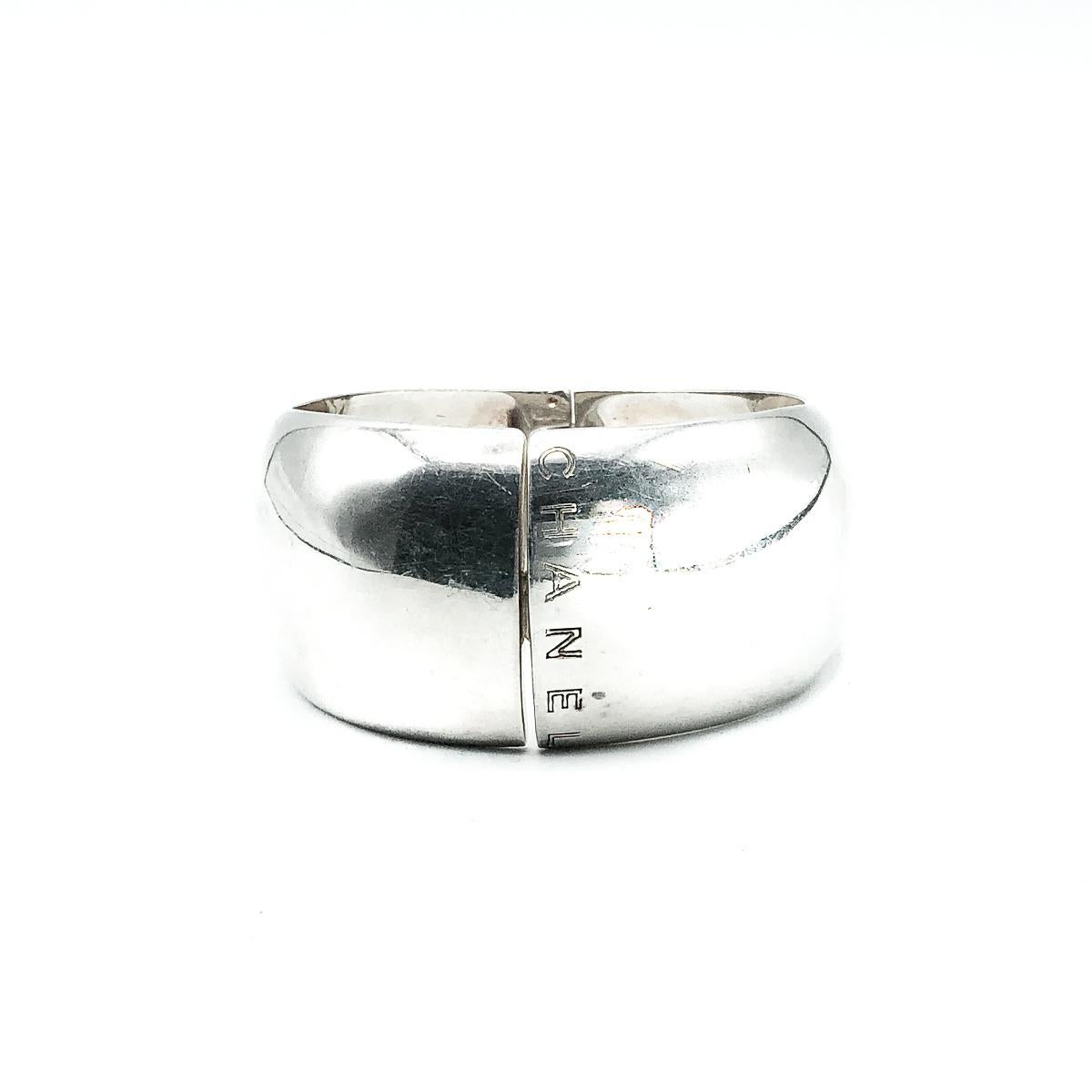 A stunning statement Vintage Chanel Silver Cuff. Large and bold and crafted with a weighty amount of solid silver. Finished with the CHANEL lettering to the front edge. In very good vintage condition, signed and stamped with full French silver 925