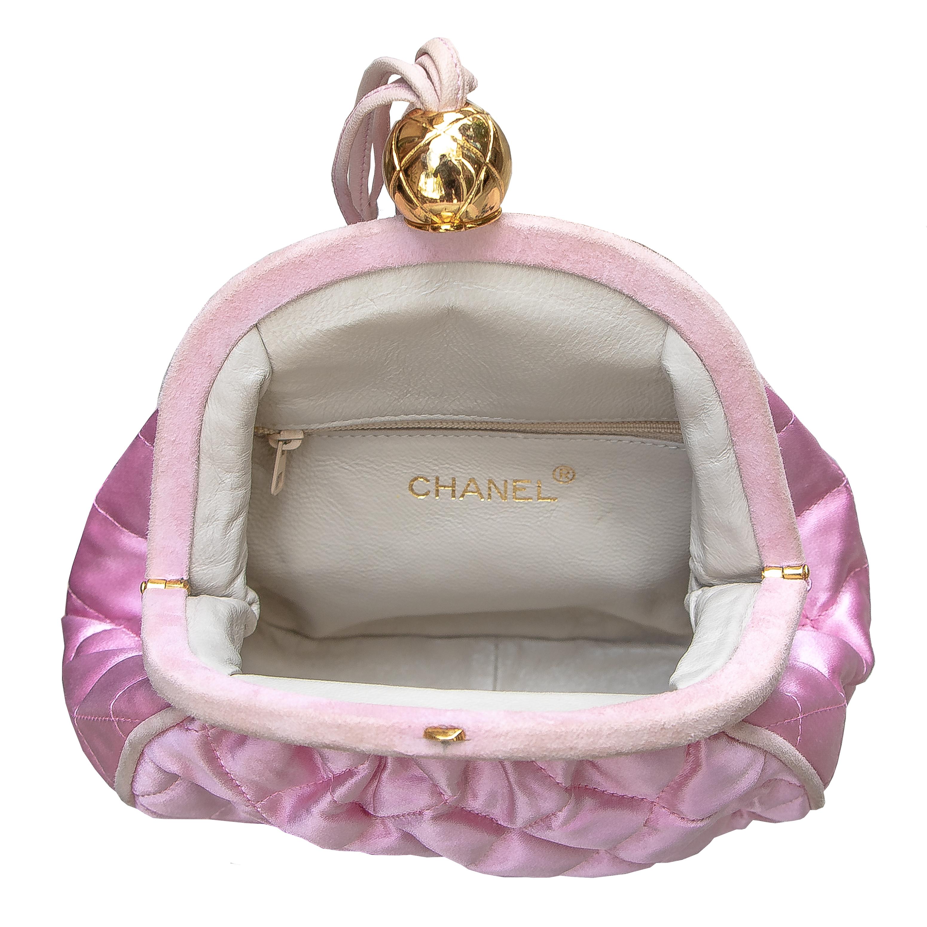 Vintage Chanel handbag yellow gold color hardware. Silk and suede like materiel, with leather straps. One main pocket with an additional small zippered section. Signed Chanel on the bottom, and Made in Italy. Too cute for words. This purse make me