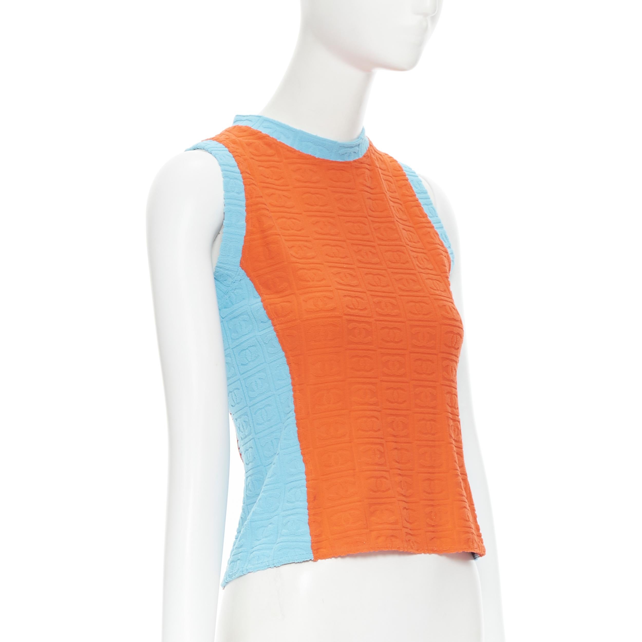 vintage CHANEL Sport 2002 orange blue CC emboss jacquard terry towel tank FR40 
Reference: GIYG/A00068 
Brand: Chanel 
Designer: Karl Lagerfeld 
Material: Polyester 
Color: Blue 
Pattern: Solid 
Extra Detail: Signature CC logo embossed Terry Towel.