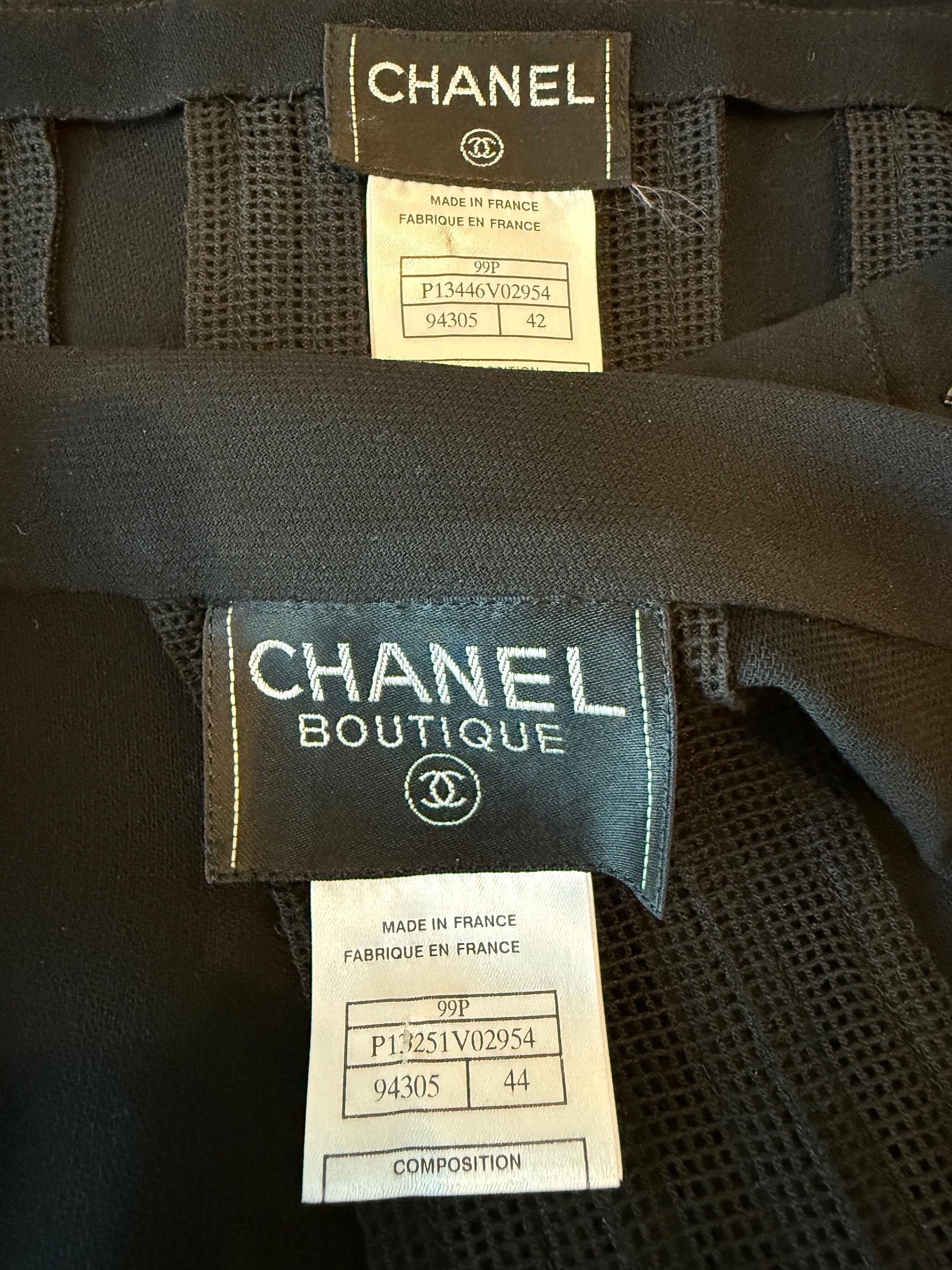 Rare and timeless chic Chanel, by Karl Lagerfeld, Spring 1999 black lightweight wool skirt suit ! A fashionable take on the classic black suit. Features sheer mesh panels throughout the jacket and skirt. Jacket I s open front, and skirt has a hidden