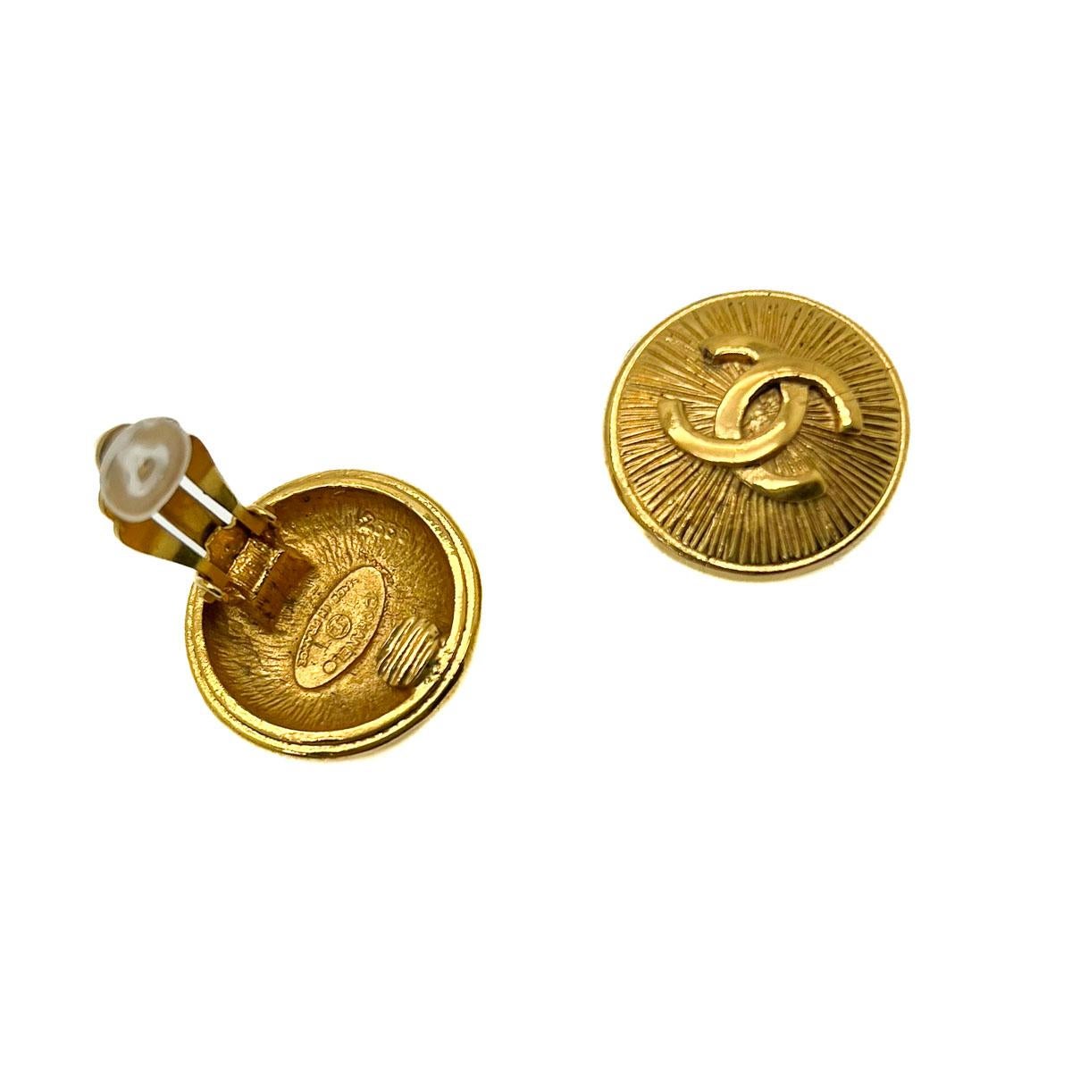 A Pair of Vintage Chanel CC Sunburst Earrings. Centring on the iconic theme of the sunburst immortalised by Coco Chanel in her early fine jewellery collections. Adorned in true 80s Lagerfeld style with the iconic interlocking CC logo. The