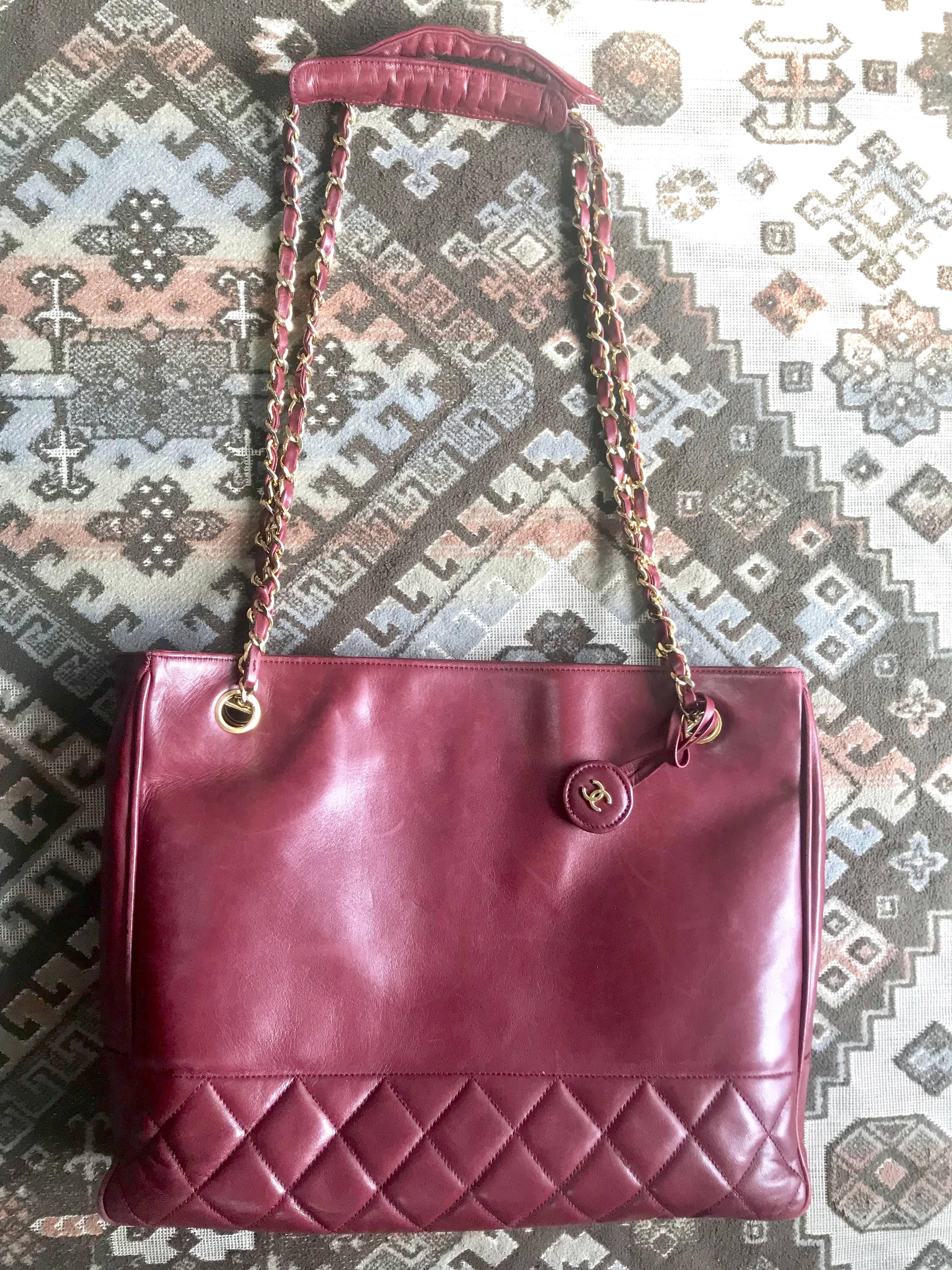 1980s. Vintage CHANEL wine leather tote bag with gold chain handles and CC motif charm. Classic purse.

This is a vintage leather CHANEL bag in a rare wine color with golden chain straps from the 80’s.

Best item to go with your any outfits in any