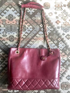 Chanel Vintage wine leather tote bag with gold chain handles and CC motif charm
