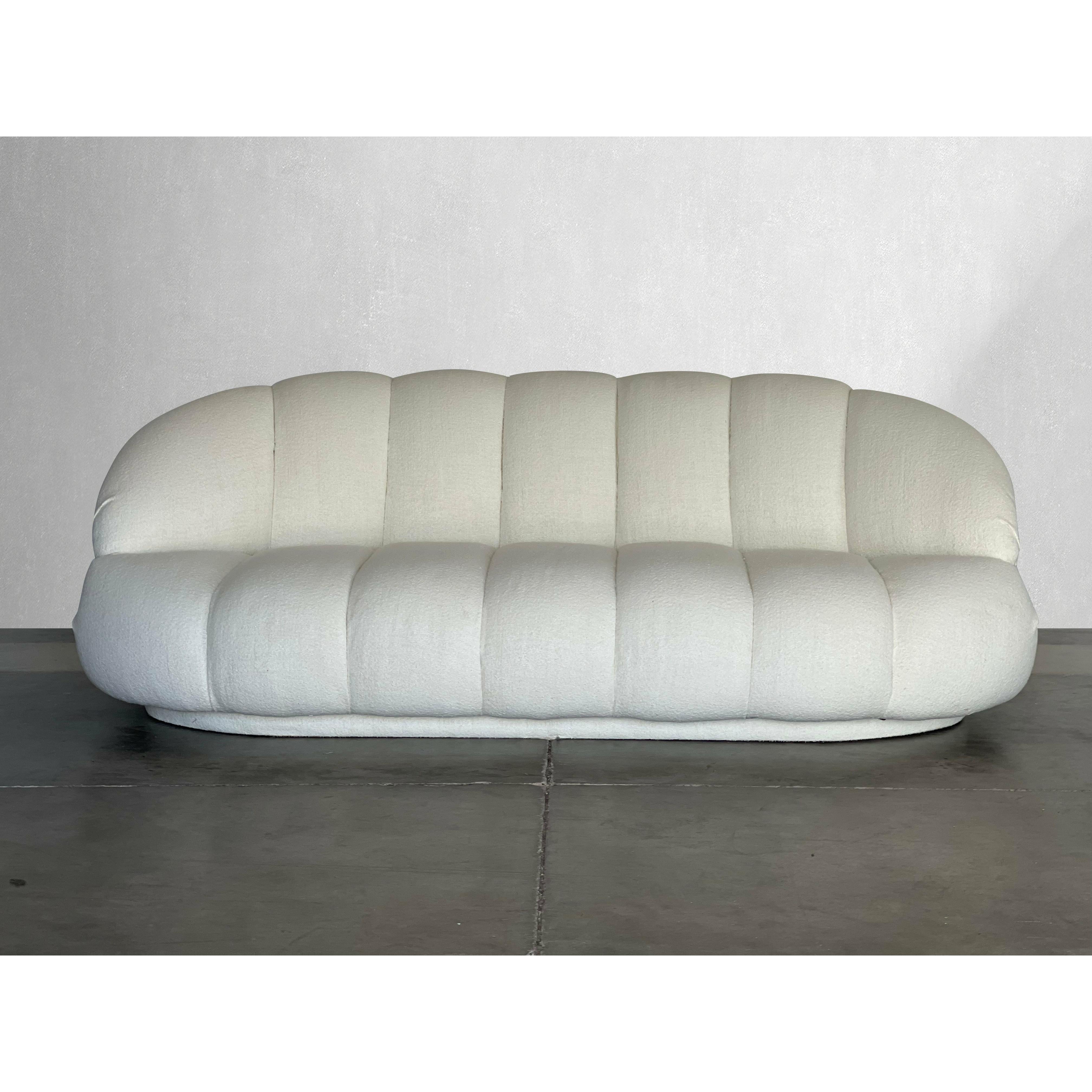 Beautifully channeled sofa by A. Rudin recovered in Italian Boucle. The fabric and construction of this sofa is very high quality. It is a beautiful and timeless piece that fits well into many spaces and with many décor styles. Truly one of our