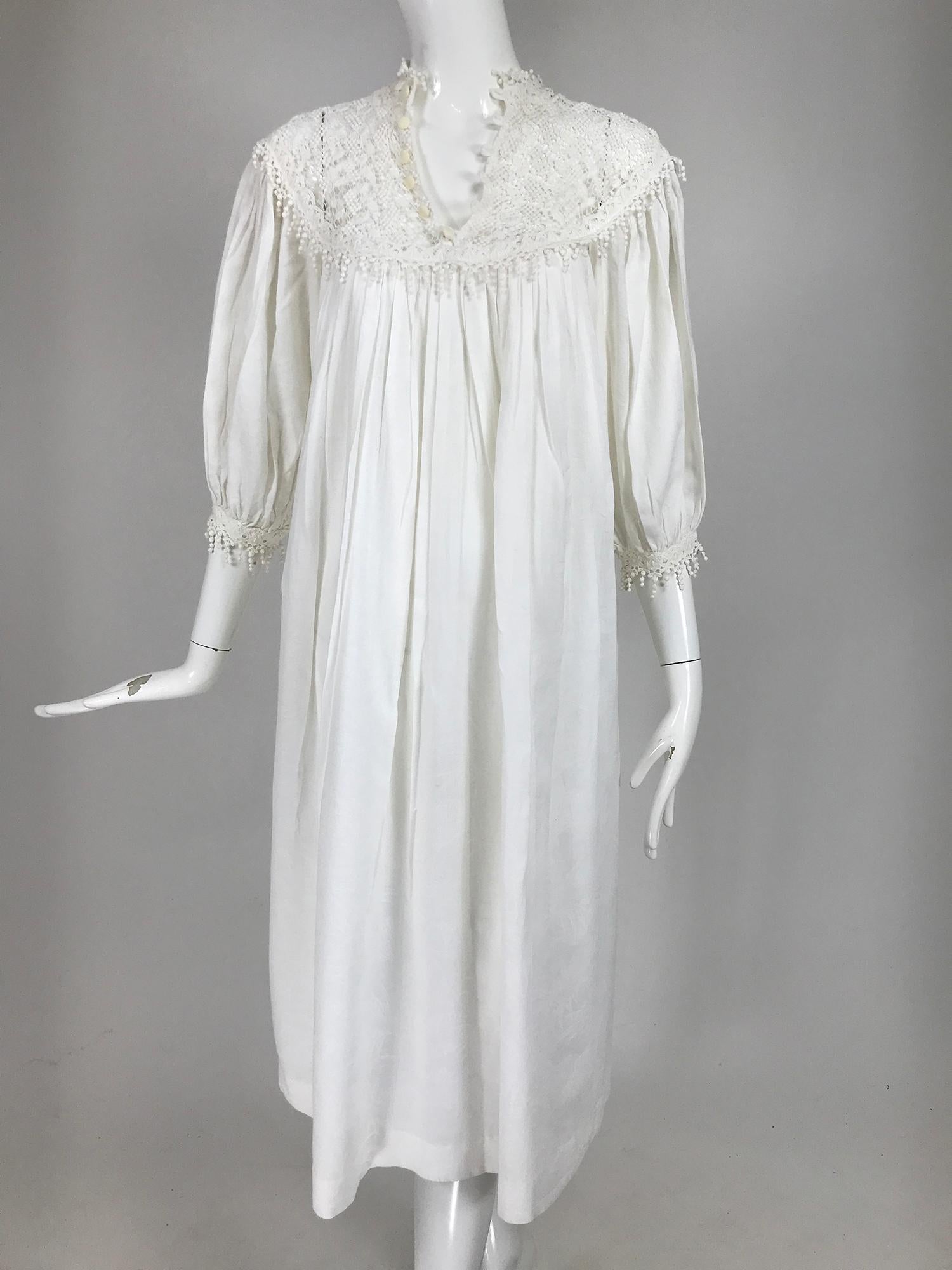 Vintage Chantal Thomass ivory crochet yoke cotton damask peasant dress from the 1970s. Pull on dress with a deep round yoke and narrow band collar of crochet lace, it closes at the front with buttons and loops. The dress has raglan sleeves the cuffs