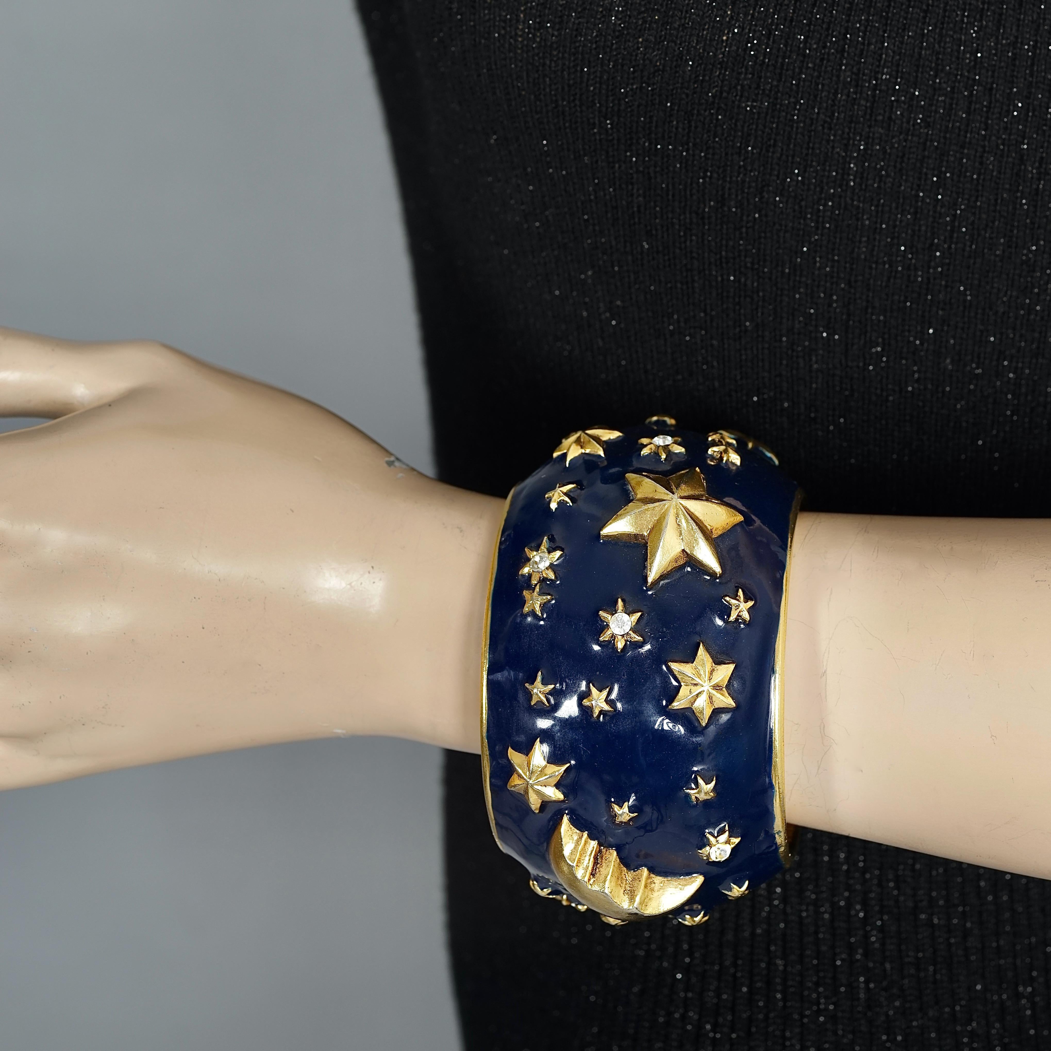 Vintage CHANTAL THOMASS Star Moon Enamel Cuff Bracelet

Measurements:
Height: 2.12 inches (5.4 cm)
Inner Circumference: 7.67 inches (19.5 cm)

Features:
- 100% Authentic CHANTAL THOMASS.
- Moon and stars blue enamel cuff bracelet.
- Gold tone