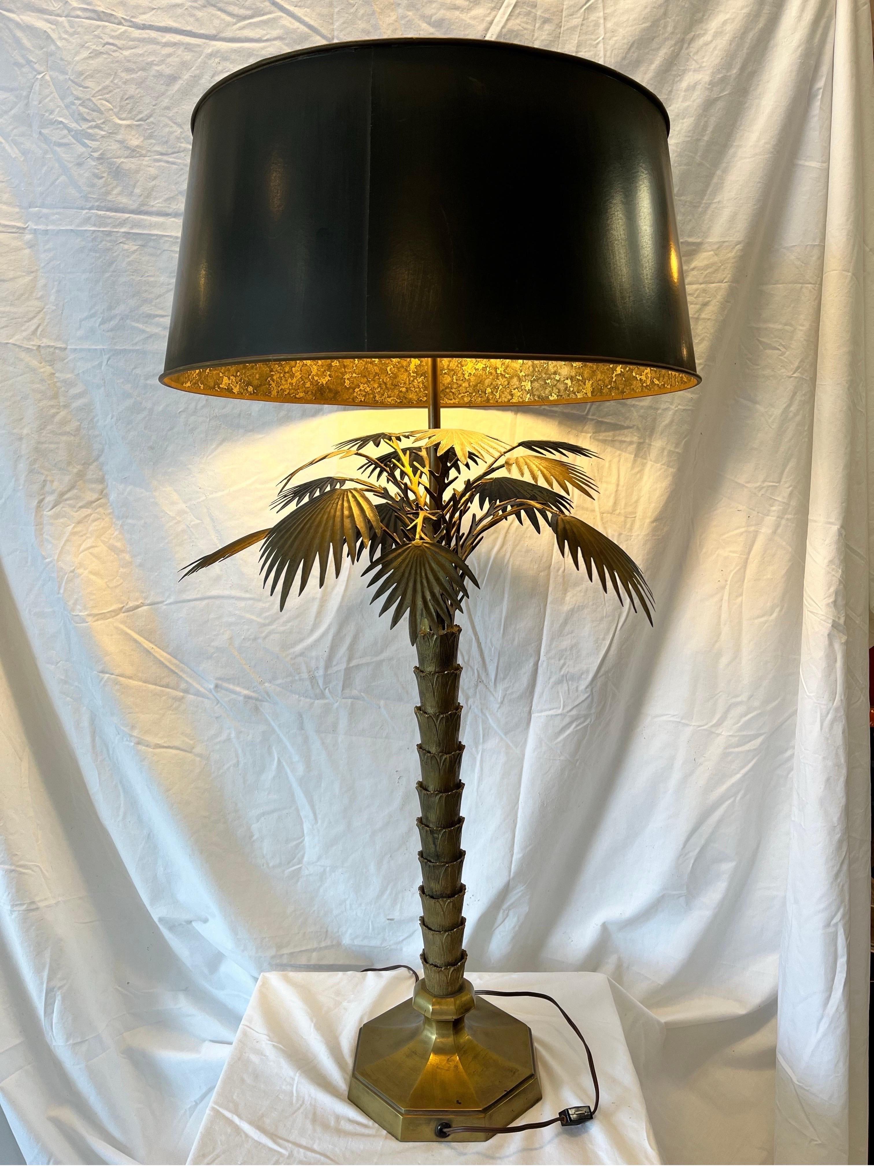 A vintage and classic Chapman oversized palm tree table lamp in brass with the original paper oil drop shade, diffuser and finial. The stylish details of the palm tree and palm fronds are expertly executed with great skill. Each of the palm fronds
