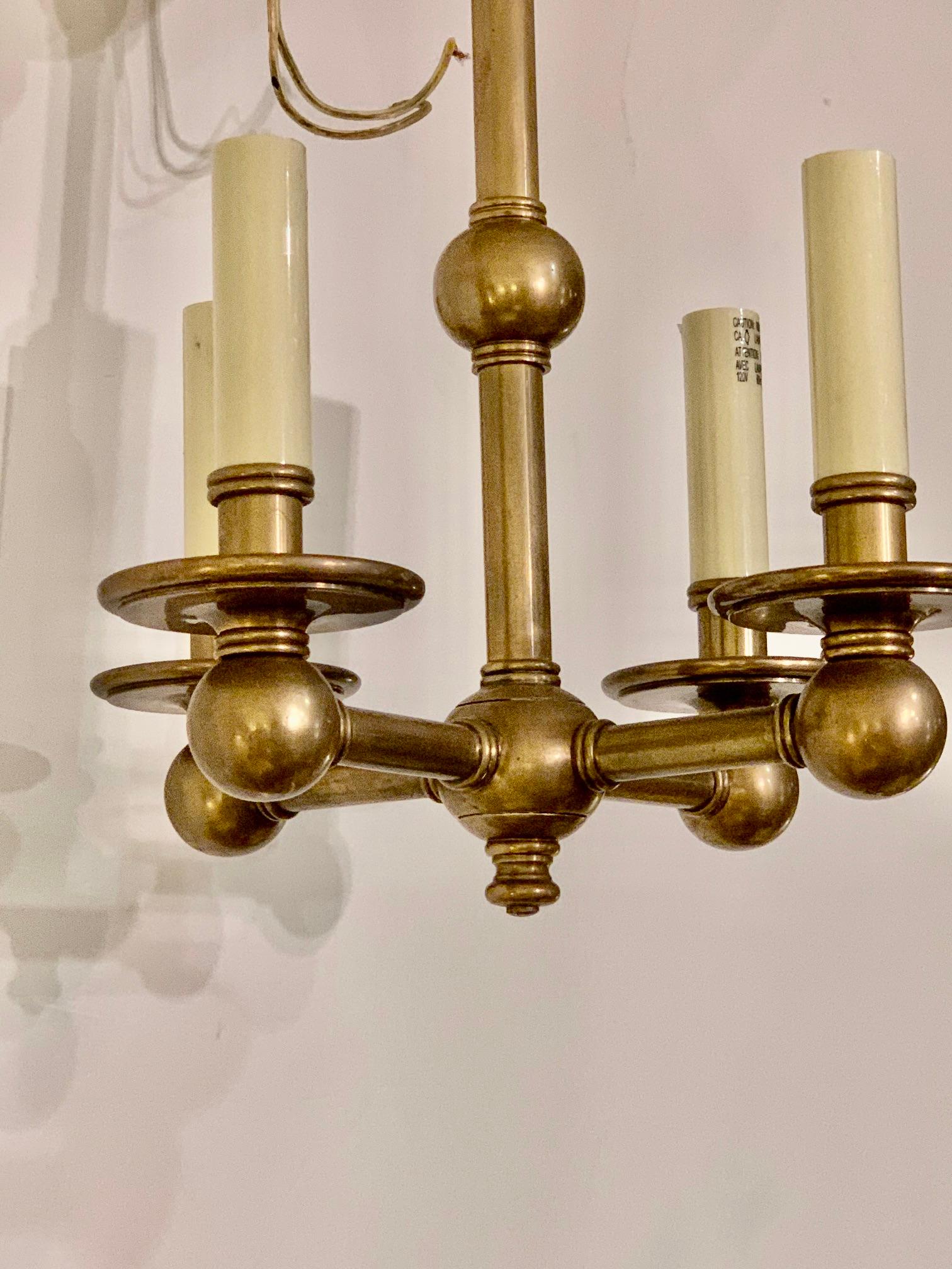 A handsome 4-arm solid brass chandelier with bronze finish by famed lighting company Chapman. Original ceiling cap included.

  