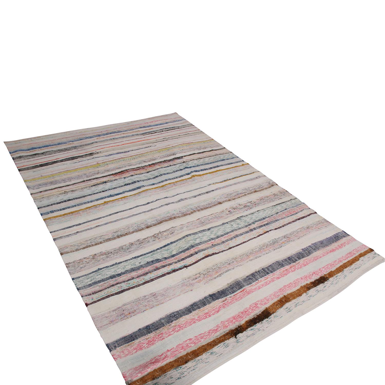 Handwoven in Turkey originating between 1970-1980, this vintage Chaput Kilim rug enjoys an admirable example of the intricate colorway variations special pieces from this family of flat-weaves enjoy. The stripes of lively pink, blue, black, read and