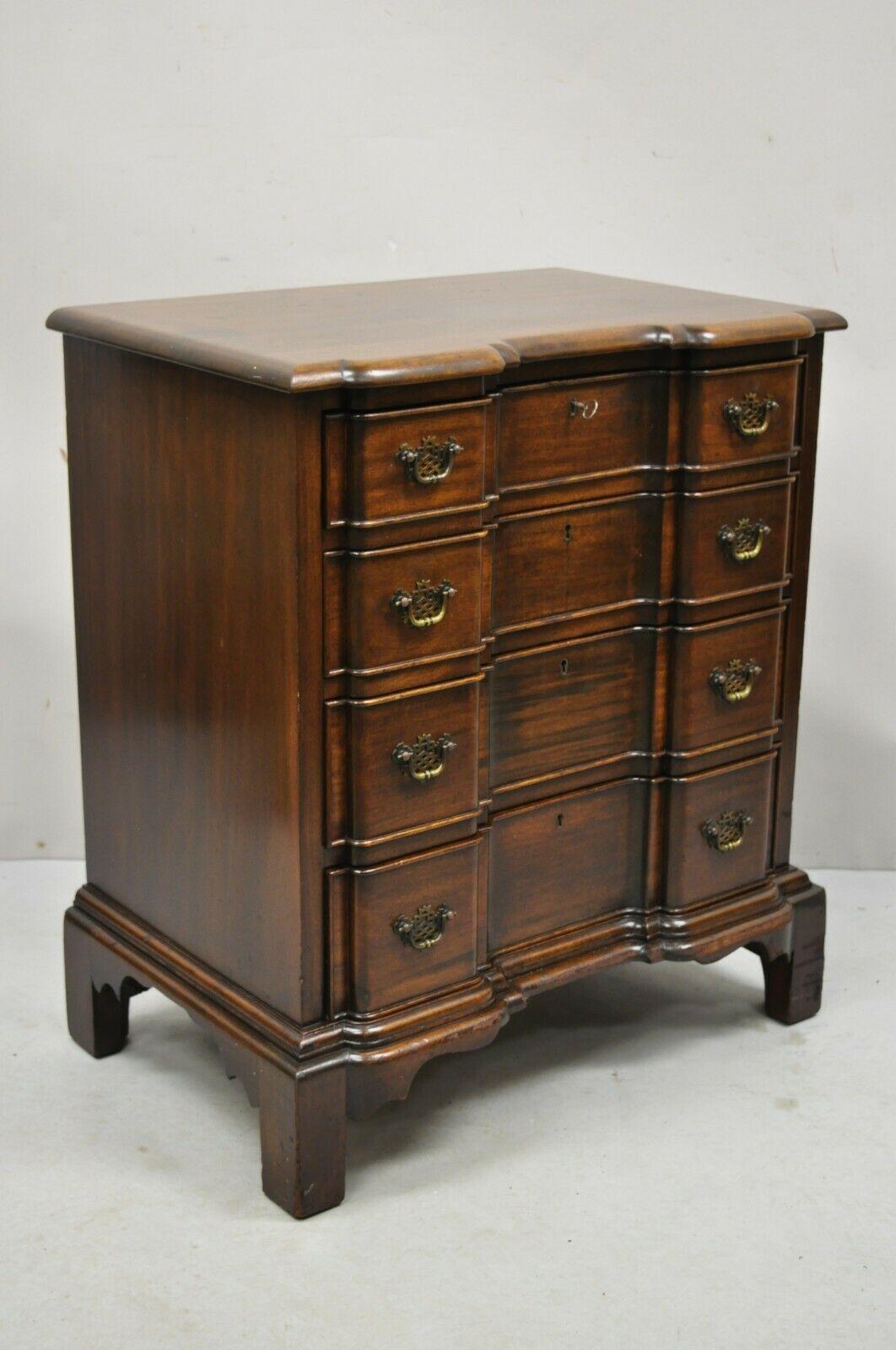 Vintage Charak English Chippendale style mahogany 4 drawer blockfront chest. Item features a carved blockfront, solid wood construction, beautiful wood grain, distressed finish, nicely carved details, original label, 4 dovetailed drawers, very nice