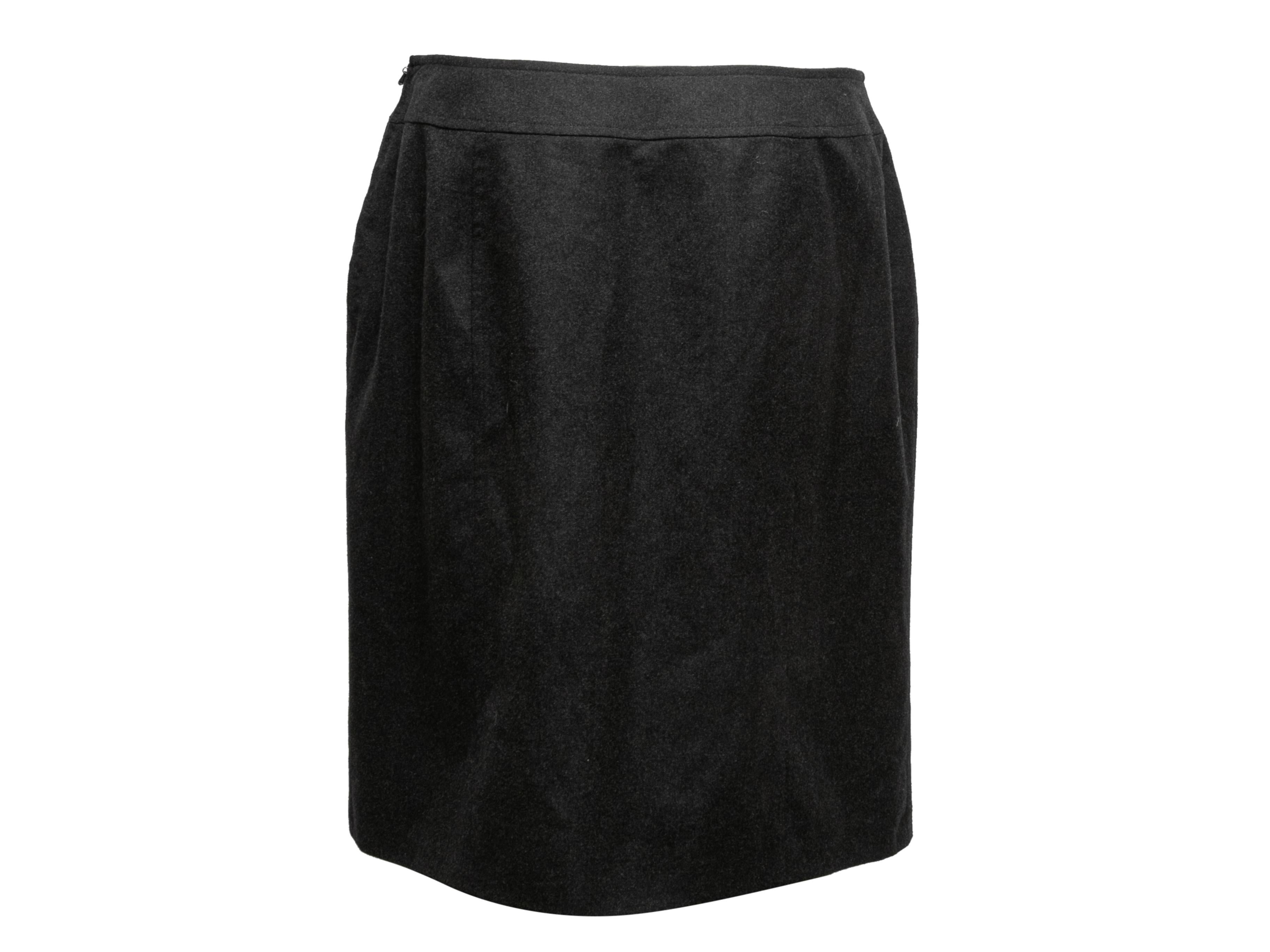 Vintage charcoal wool and cashmere-blend skirt by Chanel. From the Fall/Winter 1997 Collection. Buckle accent at front waist. Zip closure at side. 33