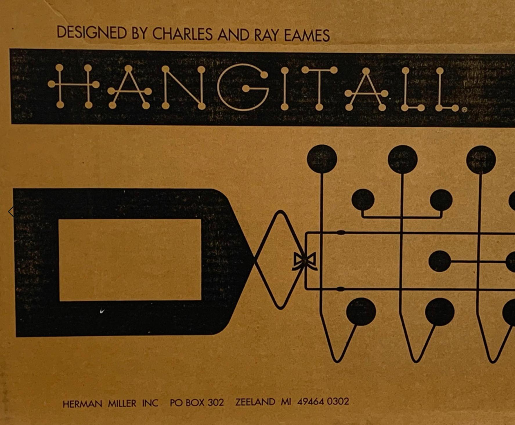 Vintage Charles and Ray Eames cherry red hang-it-all wall rack, Herman Miller. 
In the mid-1940s, Charles and Ray Eames began designing toys and furniture for children, including molded plywood animals, colorful building blocks and whimsical masks.