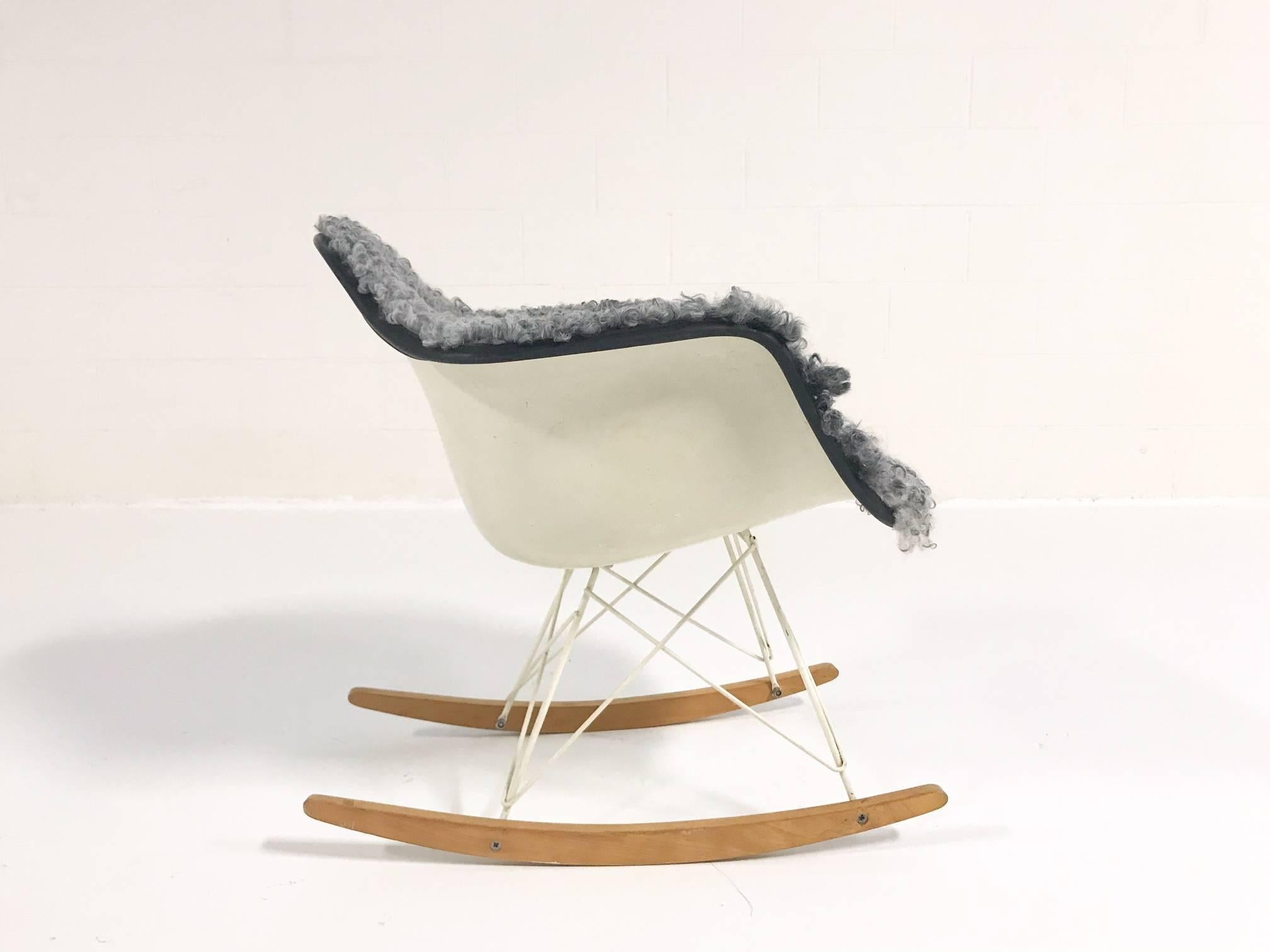 The classic Eames Rocker! A cult-favourite design gets an added oomph, restored in our cozy, soft, classicly-hued Gotland sheepskin. What a beautiful piece!

Herman Miller
USA, 1950-1969.
Molded fiberglass, enameled steel, birch, rubber, and