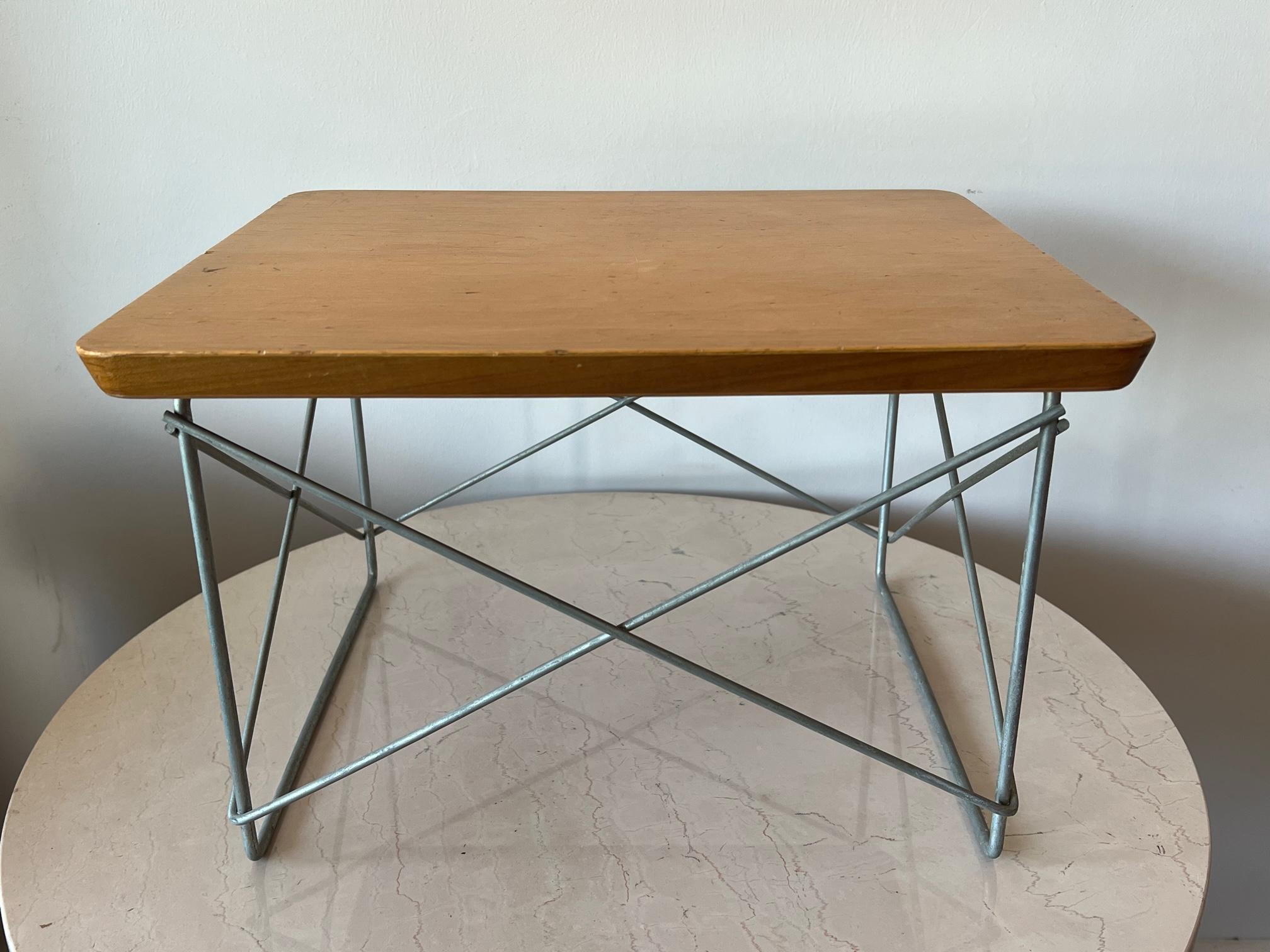 A fine Charles Eames, LTR table. Birch veneer, zinc base, all original-unrestored. Signed with a medallion label underneath.