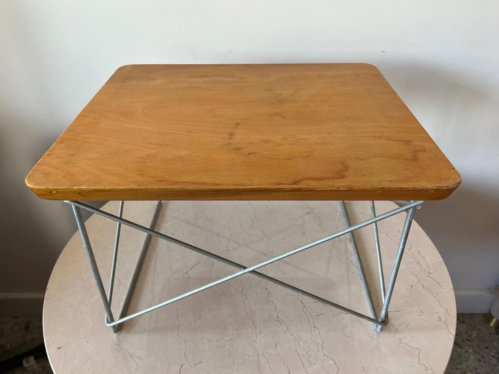 A fine Charles Eames, LTR table. Birch veneer, zinc base, all original-unrestored. Signed with a medallion label underneath.