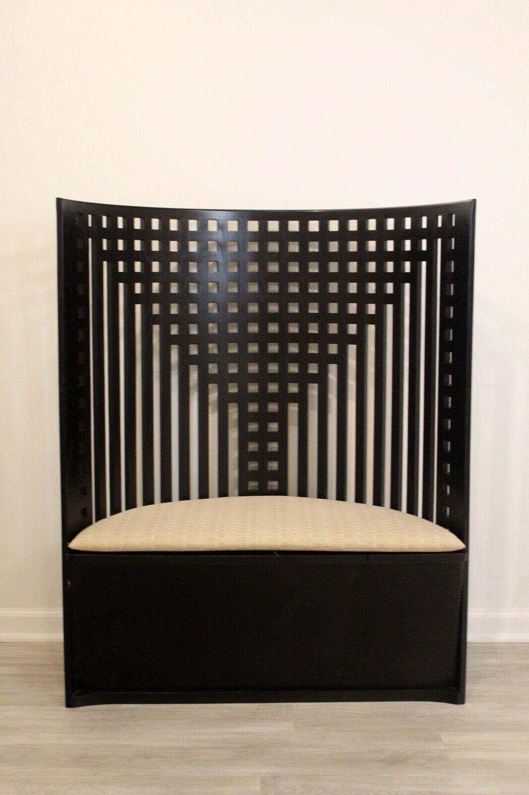 This throne-armchair designed by Charles Rennie Mackintosh in 1904. Relaunched in 1973. Manufactured by Cassina in Italy. This throne-like armchair is a new iteration of the model that CRM donated, in 1904, to the “Willow Tea Rooms” in Glasgow, his