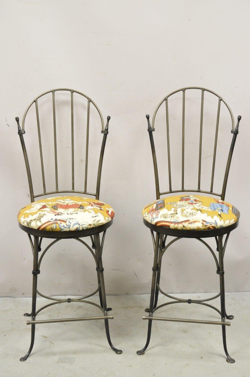 Vintage Charleston Forge Swivel Wrought Iron Counter Bar Stools - a Pair. Item features a heavy wrought iron construction, swivel seats, iron footrest, original label, quality American craftsmanship, great style and form. circa late 20th century.