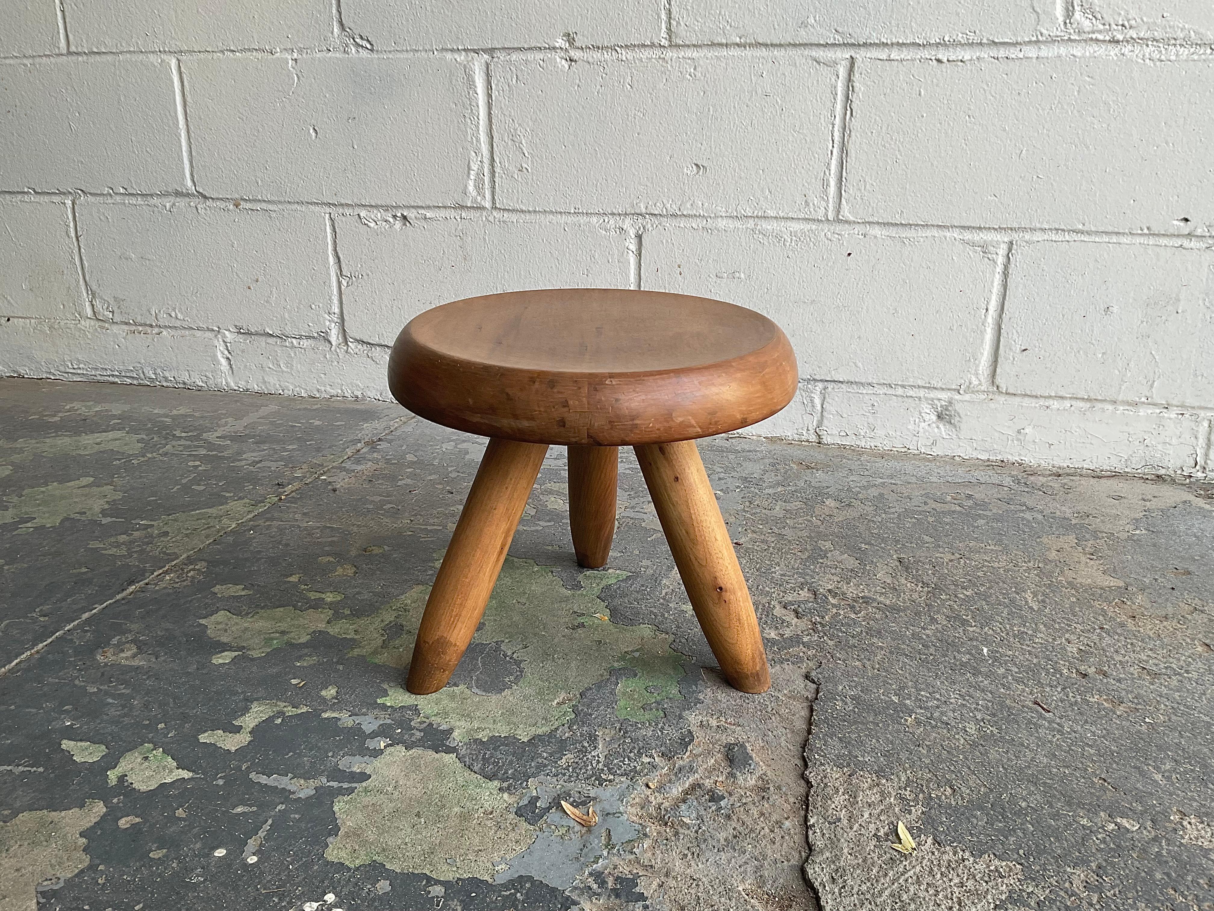 Inspired by rustic “staked” furniture of the Alps such as simple milking stools, this modern interpretation by Charlotte Perriand (1903-1999) has become an icon of 20th century modern design. Well balanced proportions, solid timber, and understated