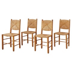 Vintage Charlotte Perriand Set of Four Chairs in Ash and Straw, France, 1950s