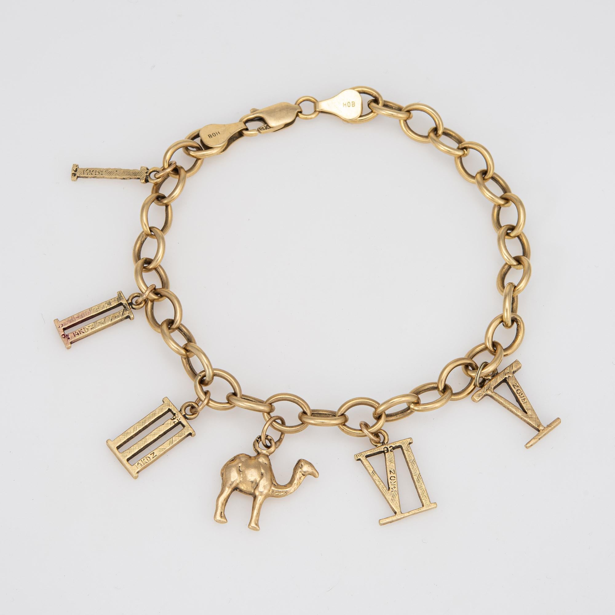 Stylish and finely detailed vintage charm bracelet crafted in 14 karat yellow gold. 

The bracelet features 6 charms with a Camel and Roman Numbers from 1-5. The bracelet is great worn alone as a statement piece or layered with your fine jewelry