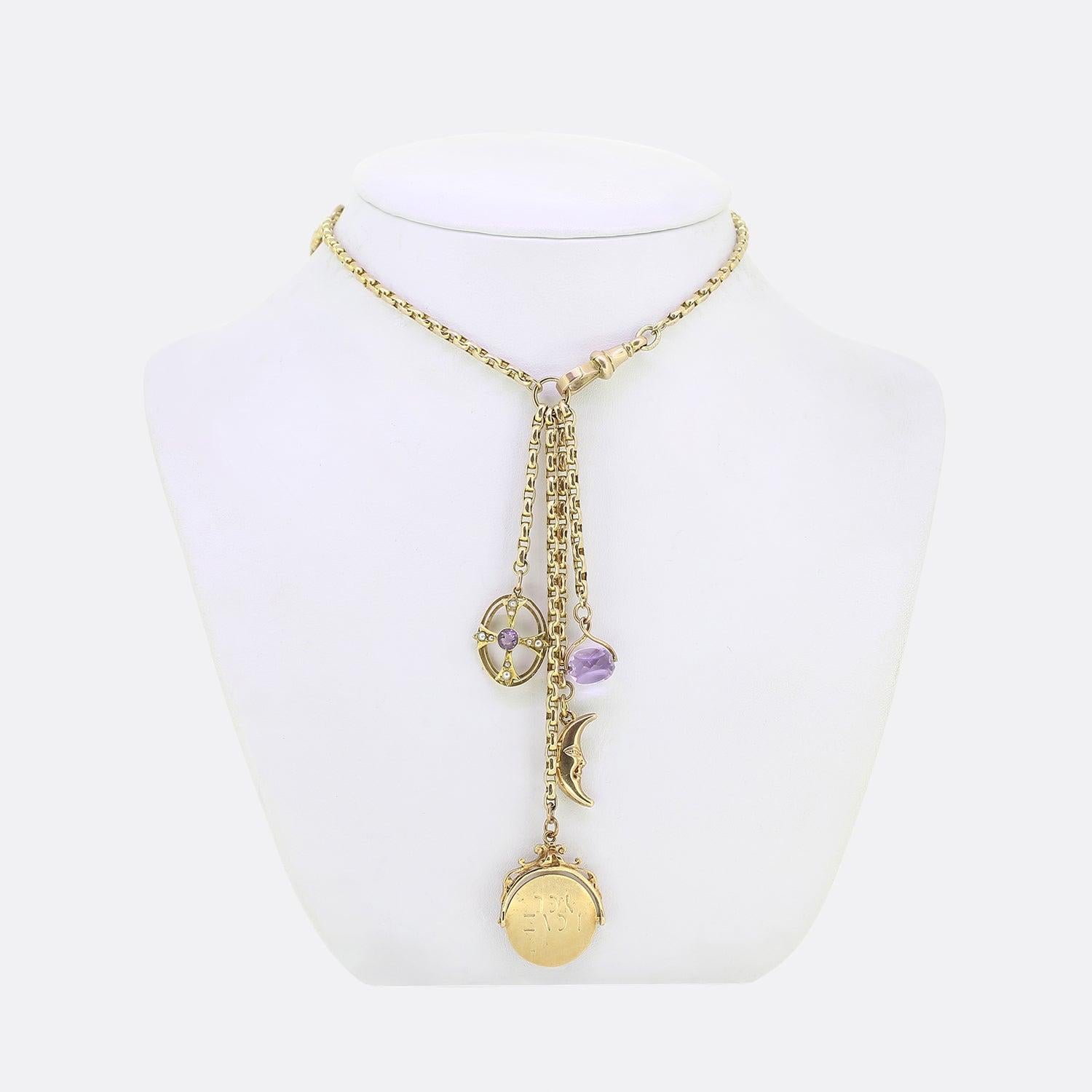 Here we have a vintage 9ct yellow gold belcher chain charm necklace. The necklace plays host to a four freely hanging pendants including an amethyst and seed pearl cross, 'I LOVE YOU' spinner, moon crescent and amethyst spinner.
The main chain