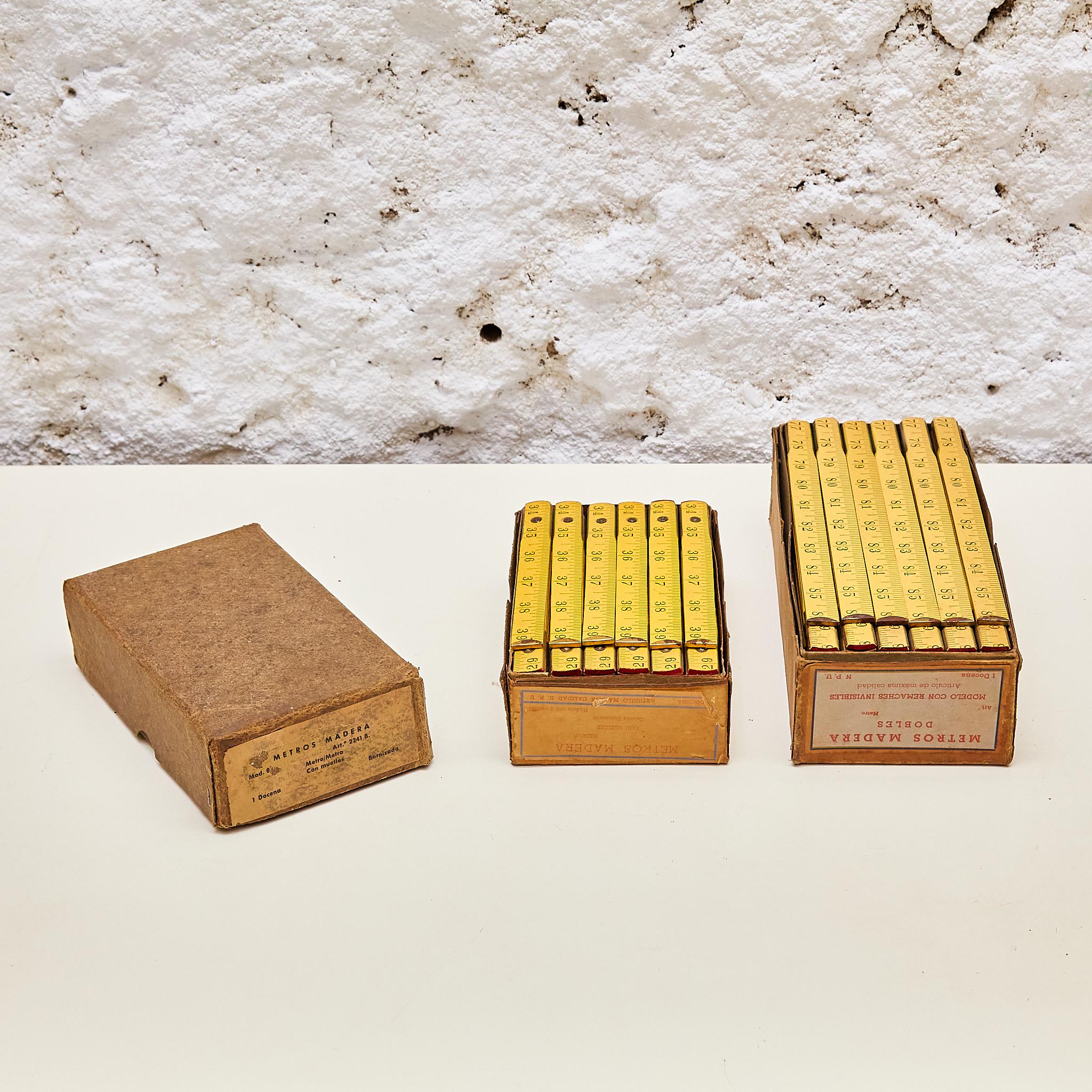 Discover vintage allure with this remarkable set of 36 antique wooden measuring tapes, complete with their original boxes, dating back to circa 1940. Each piece in this collection transports you to a bygone era, evoking the nostalgia of