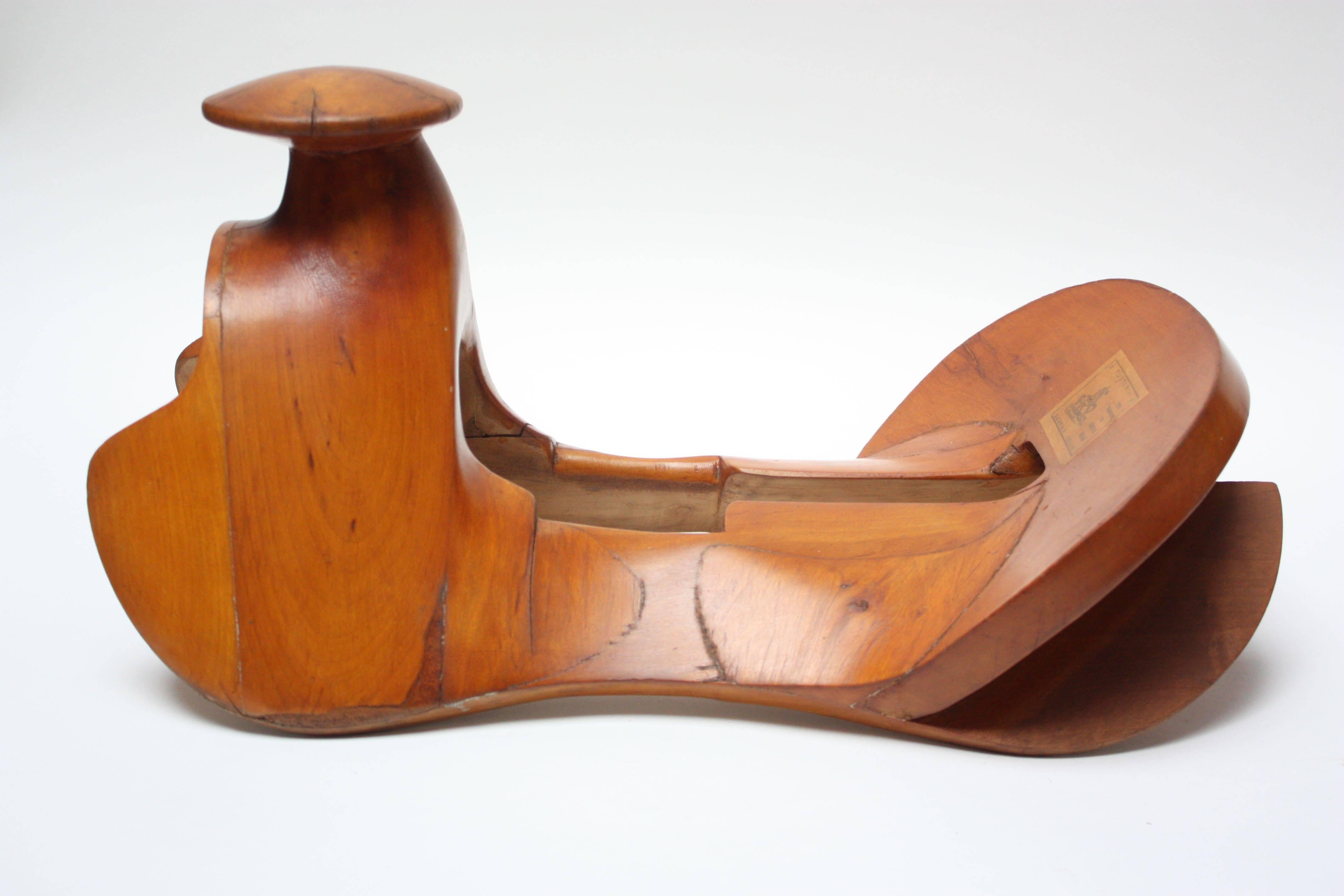 Saddle tree / saddle base (circa 1970s, Teziutlan Mexico) composed of carved cherrywood. Known as a 'charro' saddle tree after the Mexican horsemen 'charros' who used this style of saddle characterized by its wider seat and larger Horn. 
Works
