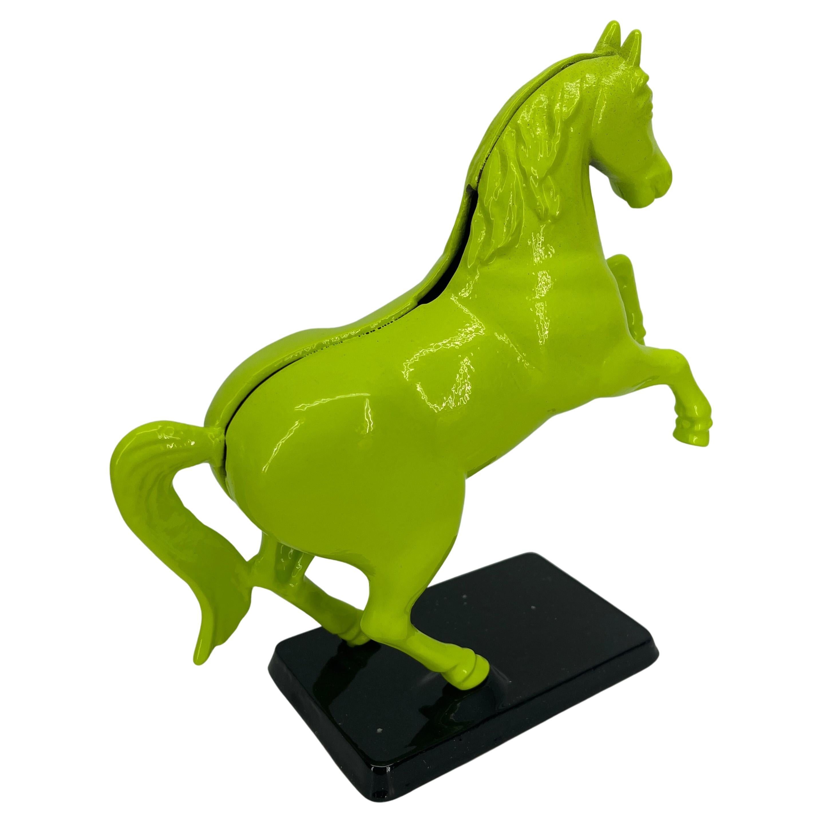 Vintage cast iron money bank horse sculpture. The money bank is mounted on a black base. The horse stands proudly on it's stand. Shining in newly powder coated chartreuse and jet black, the bank is an exciting addition to a bookcase or as a desk