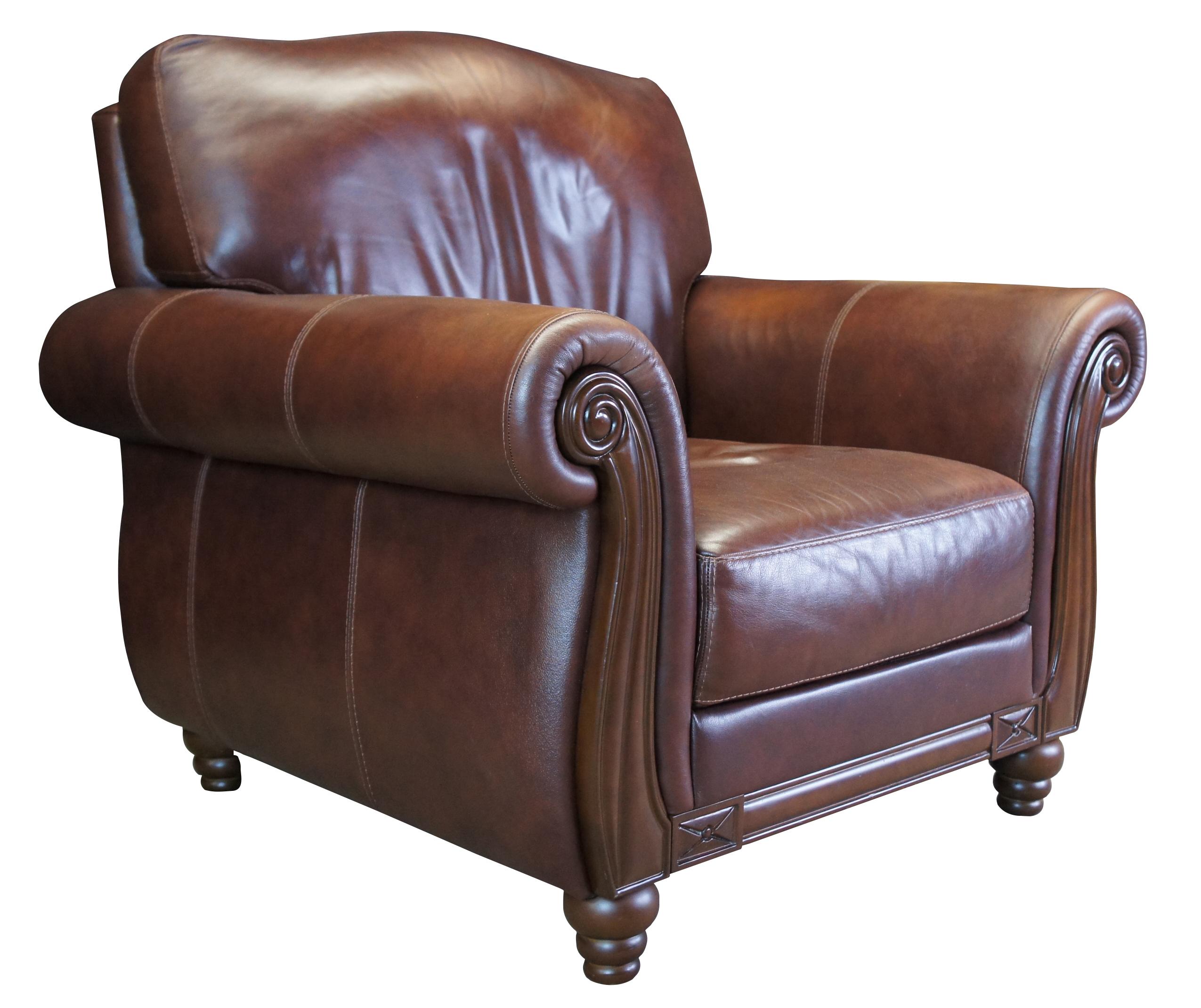 Chateau D'Ax Divani Italian Brown Leather Arm Chair. Features rolled arms, wooden trim and cascading bun feet.

Chateau d’Ax opened its business in 1948 as a result of the Colombo family’s hard work and dedication in
Lentate sul Seveso, a small