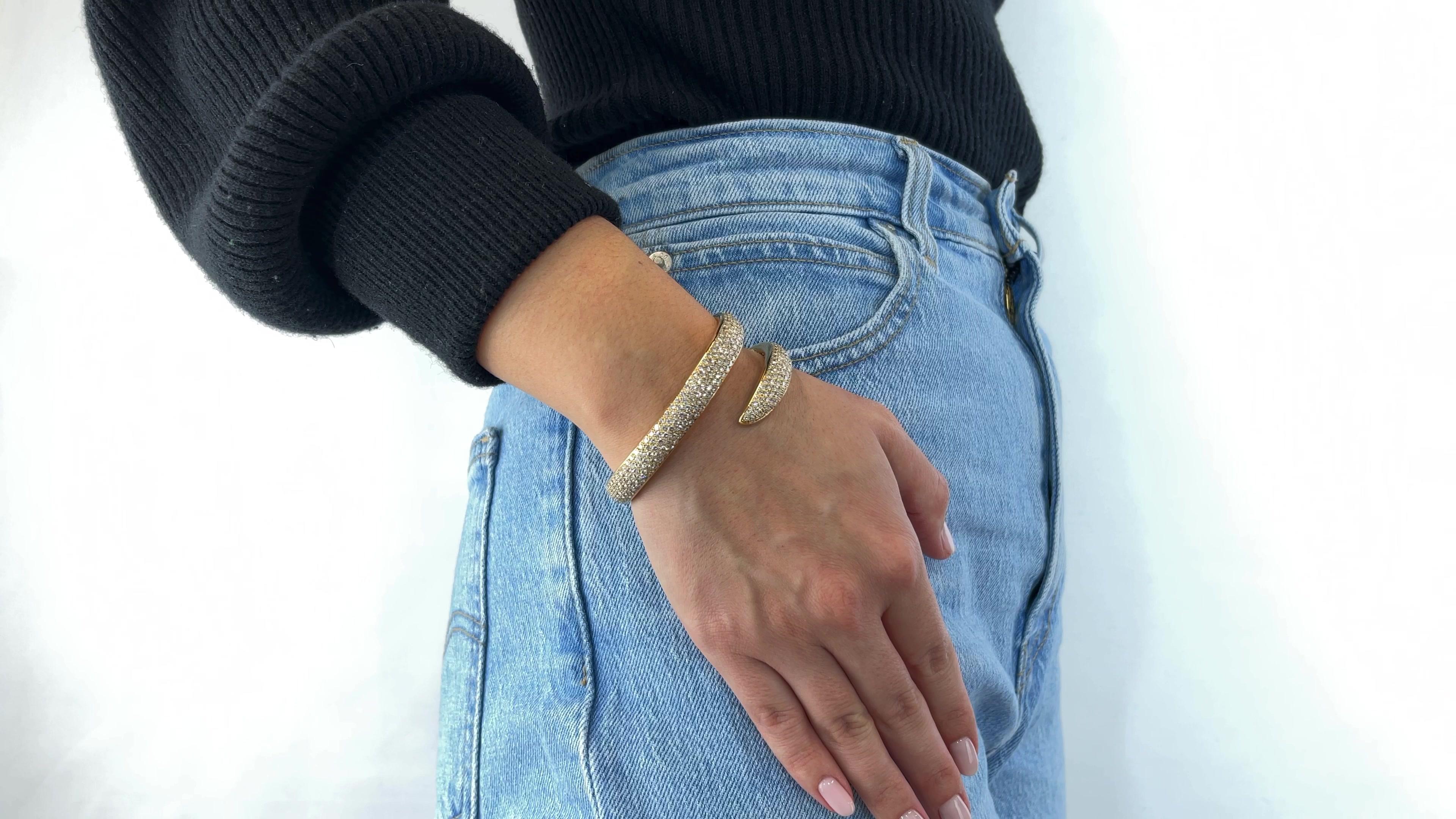 One Vintage Chaumet Diamond 18 Karat Gold Bangle. Featuring 398 round brilliant cut diamonds with a total weight of approximately 12.00 carats, graded D-E color, VVS clarity. Crafted in 18 karat yellow gold, signed Chaumet with French hallmarks,