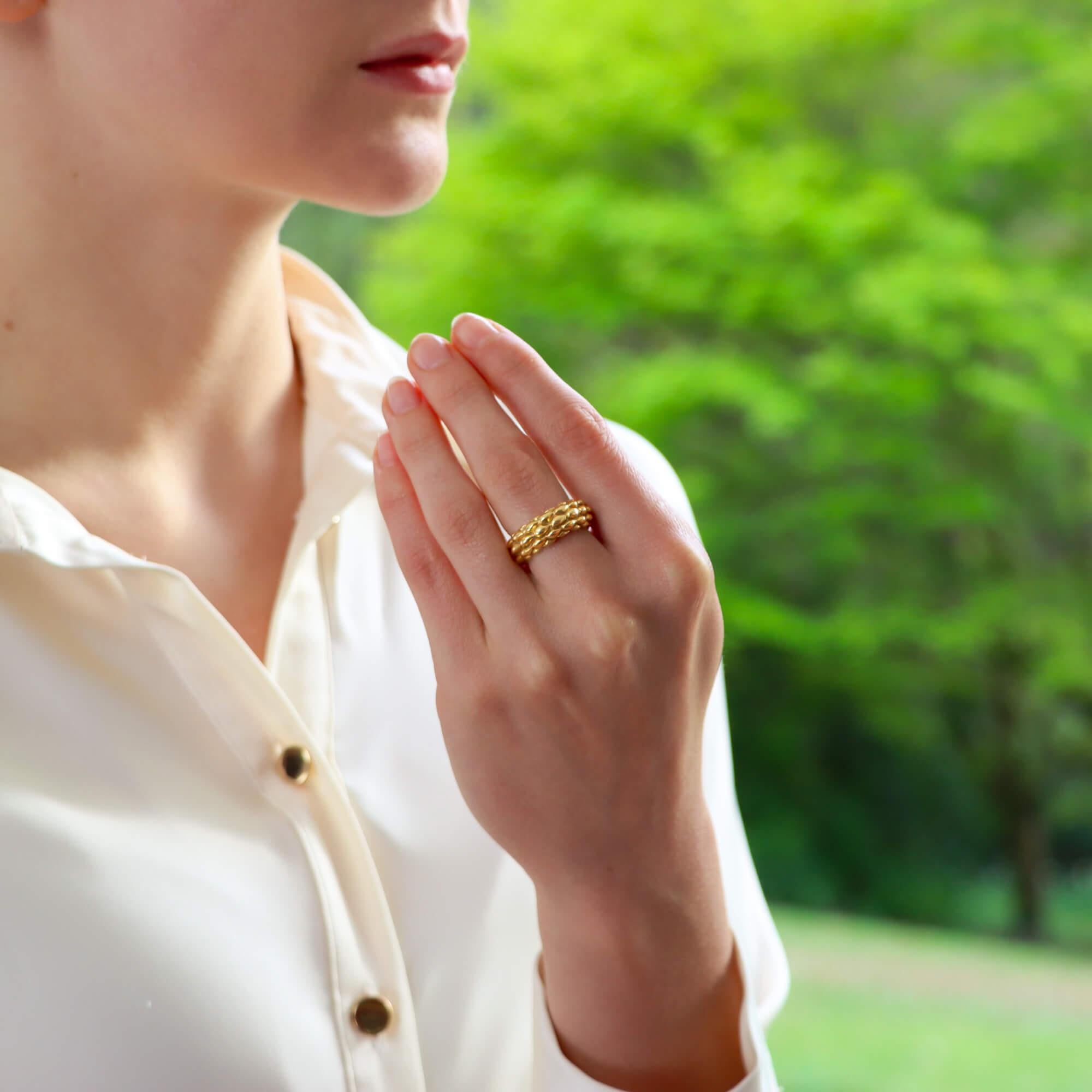  A stylish vintage Chaumet 'Oat' ring set in 18k yellow gold.

From the now discontinued Oat collection, the ring is composed in a randomized sequence of oat motifs and beautifully travels around the entirety of the finger. 

Due to the design and