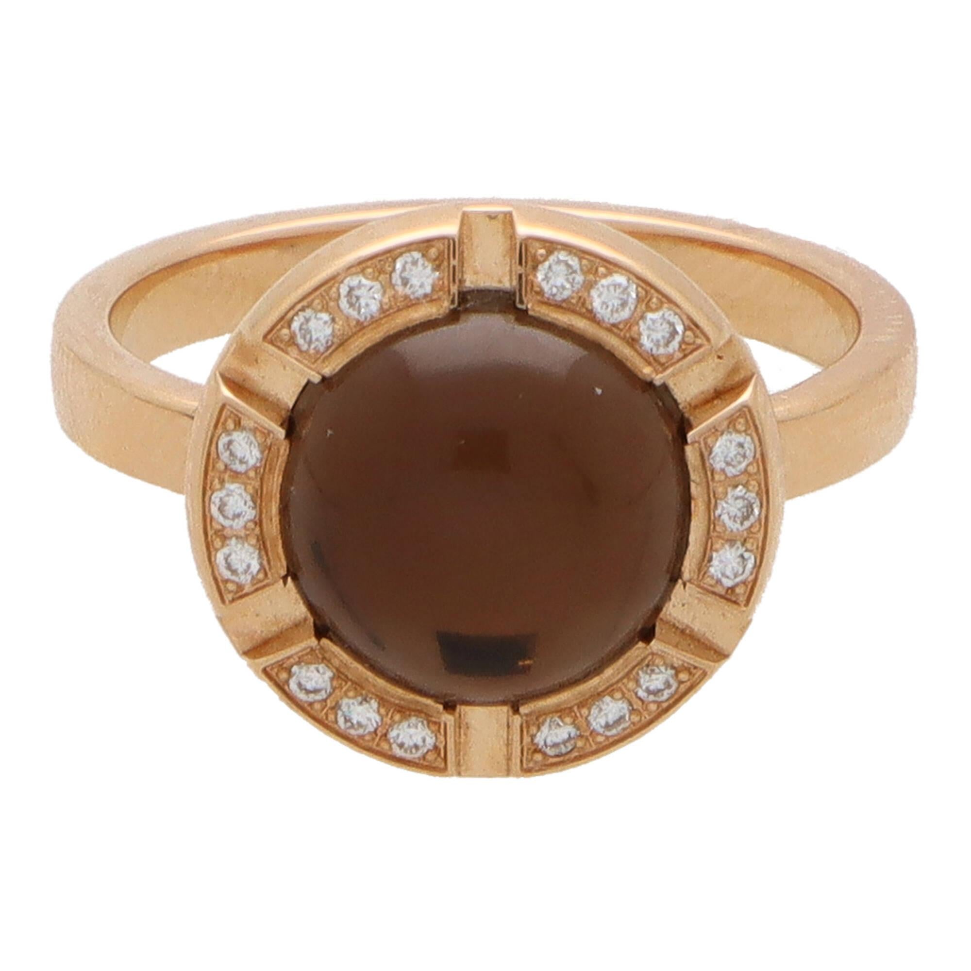 A beautiful vintage Chaumet Paris smoky quartz and diamond ‘Class One Croisiere’ ring set in 18k rose gold.

The ring is designed in a slightly raised bombé design and is centrally set with a rub over cabochon smoky quartz. The quartz is backed with