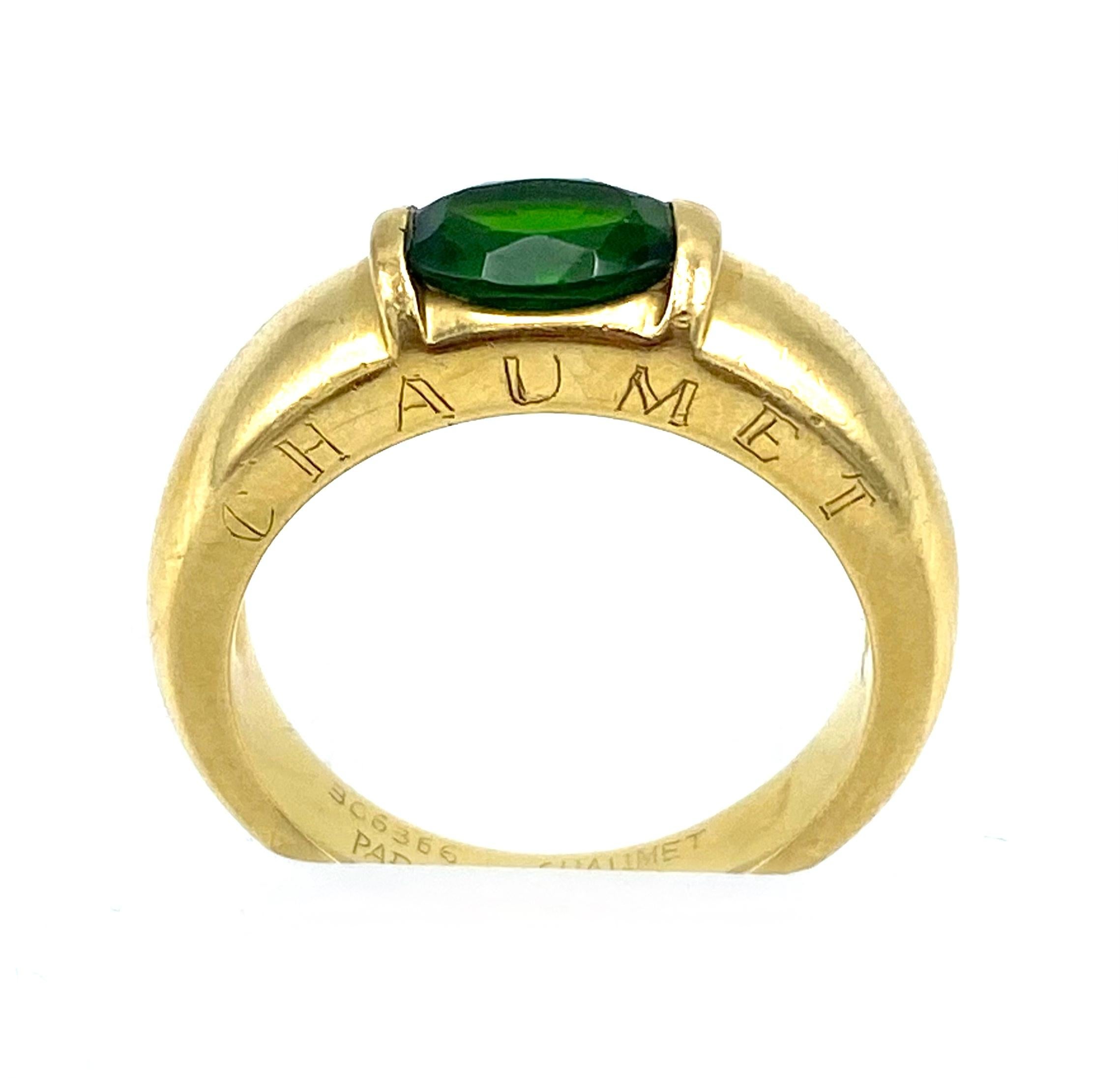 Product details:

The ring is designed by French jewelry designer Chaumet, it is made out of 18 karat yellow gold and detailed with oval cut green peridot.

Hallmarks: 366366 Paris Chaumet 750 

Ring size is 8.25.
The width on the top is 6mm and the
