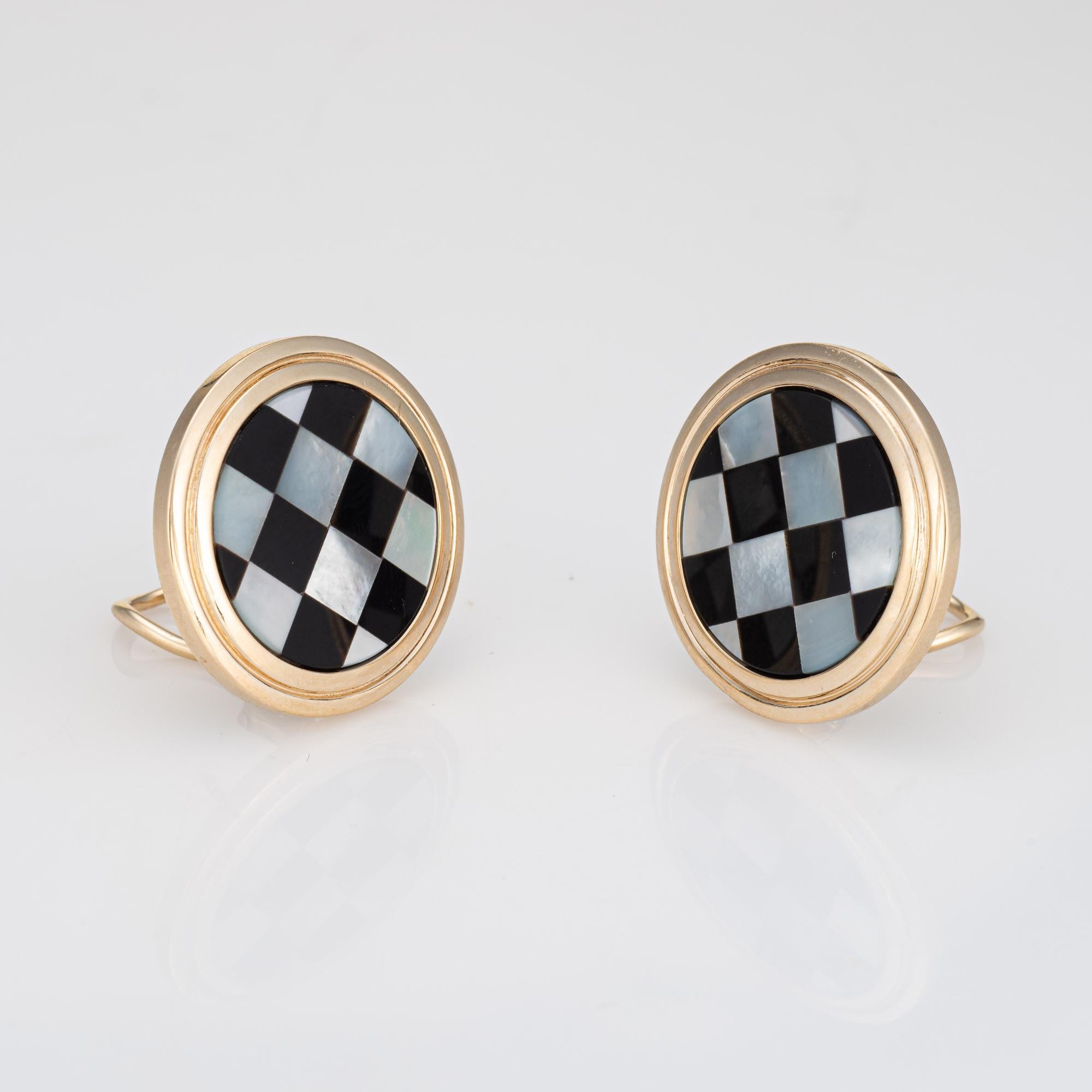
Stylish pair of Larter & Sons checkerboard earrings crafted in 14k yellow gold (circa 1970s to 1980s). 

Onyx and mother of pearl is inlaid into the mounts. 

The striking earrings are inlaid flush with luminous mother of pearl and black onyx in a