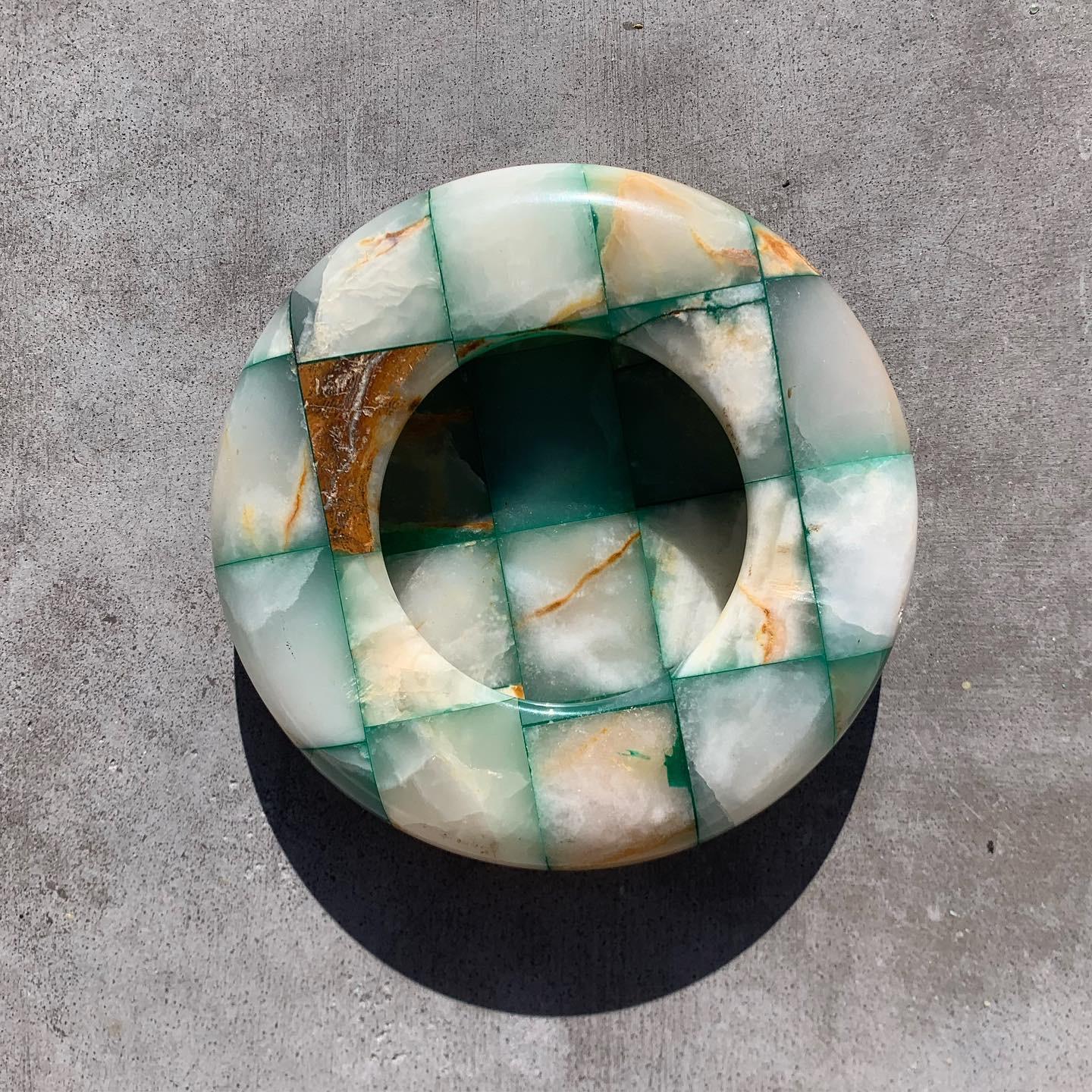 An incredibly unique Mid-Century Modern checkered onyx marble ashtray with thick curved bulbous edge, circa 1960s. Teal and pearl tones with moments of caramel. Would also work fabulously as a catchall. Minor signs of wear consistent with age but no