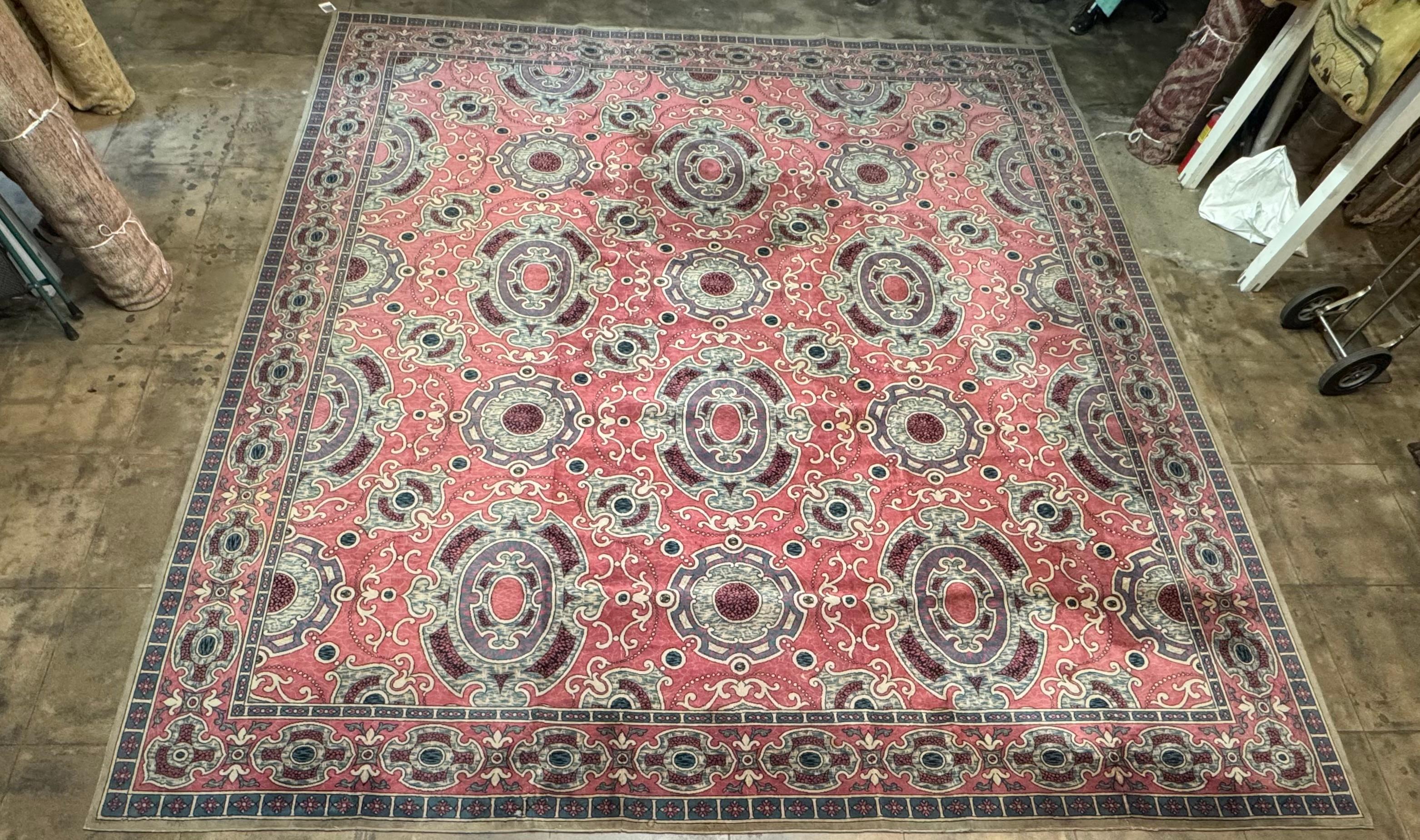 A luxurious handwoven vintage chenille rug featuring a refined Art Deco-inspired medallion design with ornate scroll motifs and an elegant border. The soft coral field is beautifully balanced with shades of powder blue, ivory, and deep wine,