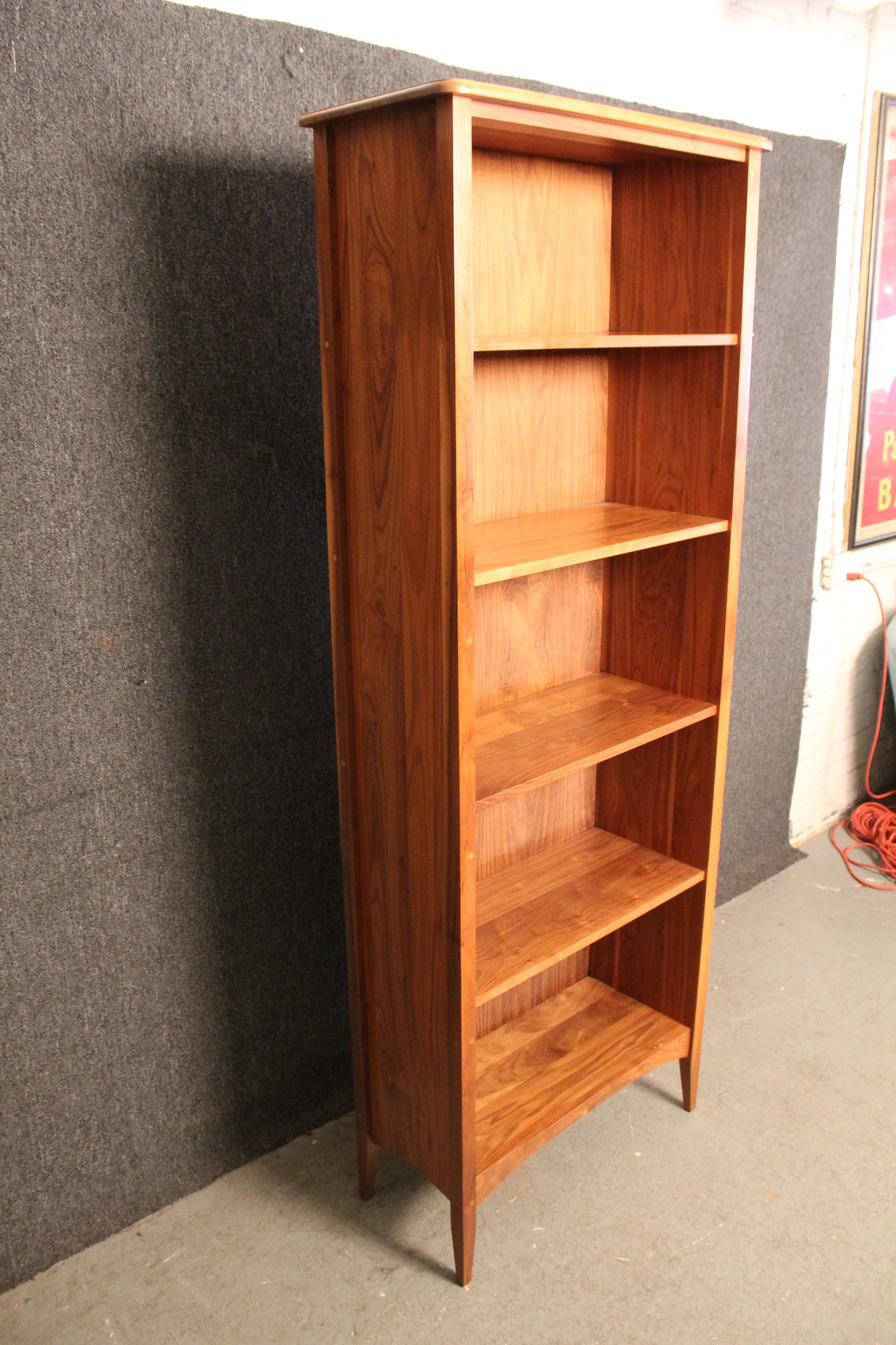 Beautifully handcrafted solid wood bookcase from the talented craftsmen of Pompanoosuc Mills Furniture of 21st-Century Vermont. A pillar of their popular, Shaker-inspired 