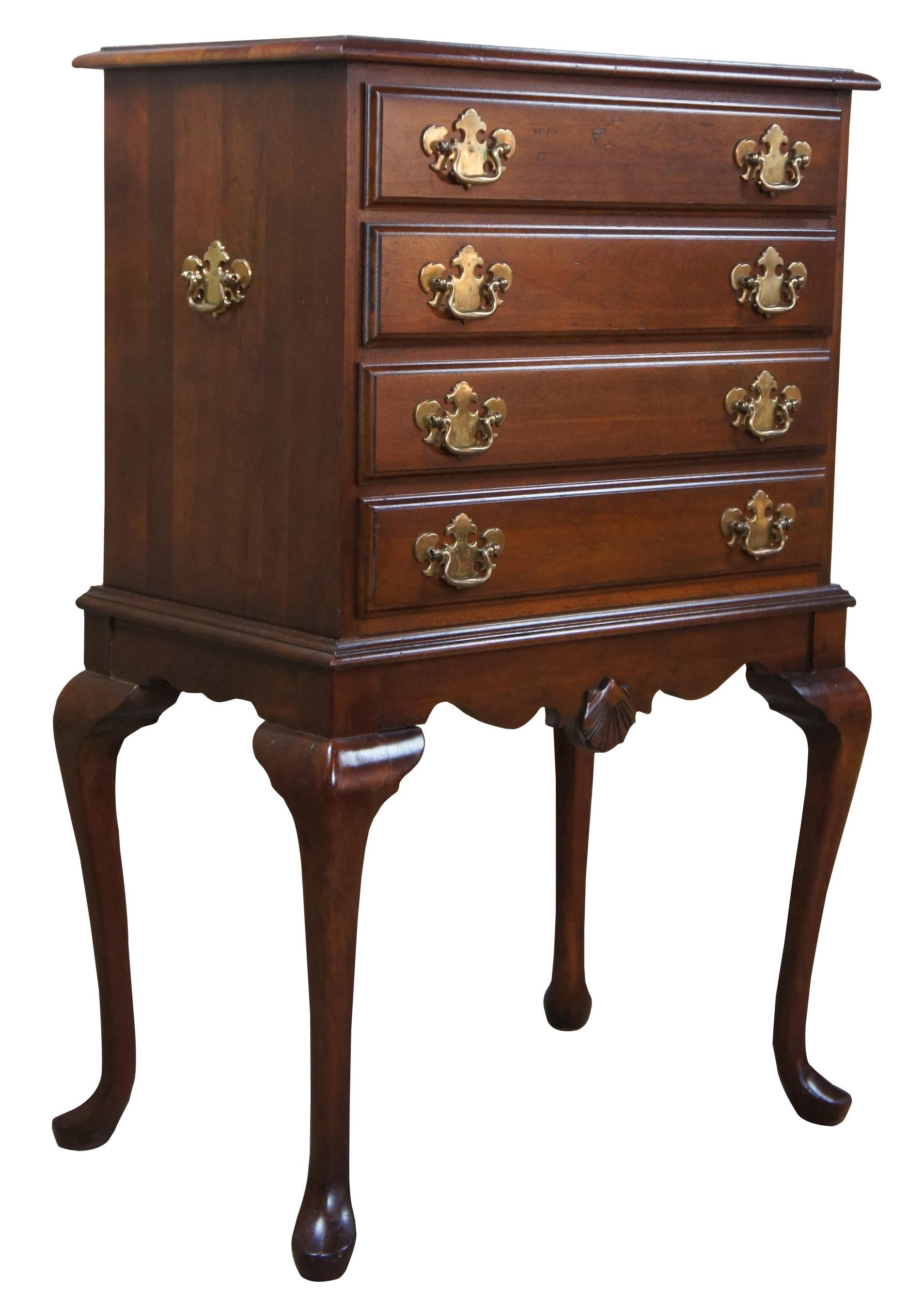 Late 20th century cherry Queen Anne silverware cabinet. Features four dovetailed drawers with silver wear lined cloth and brass hardware. Chest features a serpentine apron with scallop over Queen Anne legs leading to pad feet. Measure: 38