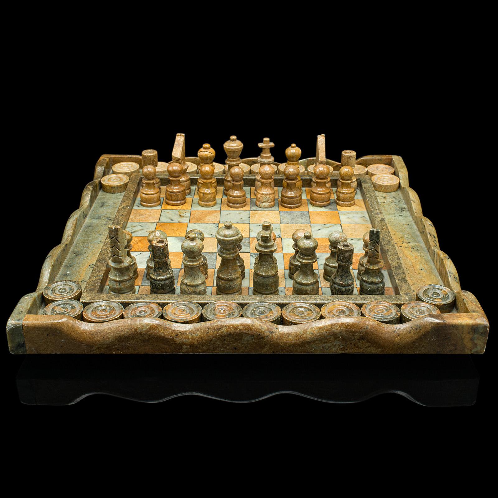 This is a vintage chess and draughts board. An English, hardstone and marble gaming set, dating to the late 20th century, circa 1970.

Dual purpose gaming set with fascinating natural detail
Displays a desirable aged patina throughout
Hardstone and