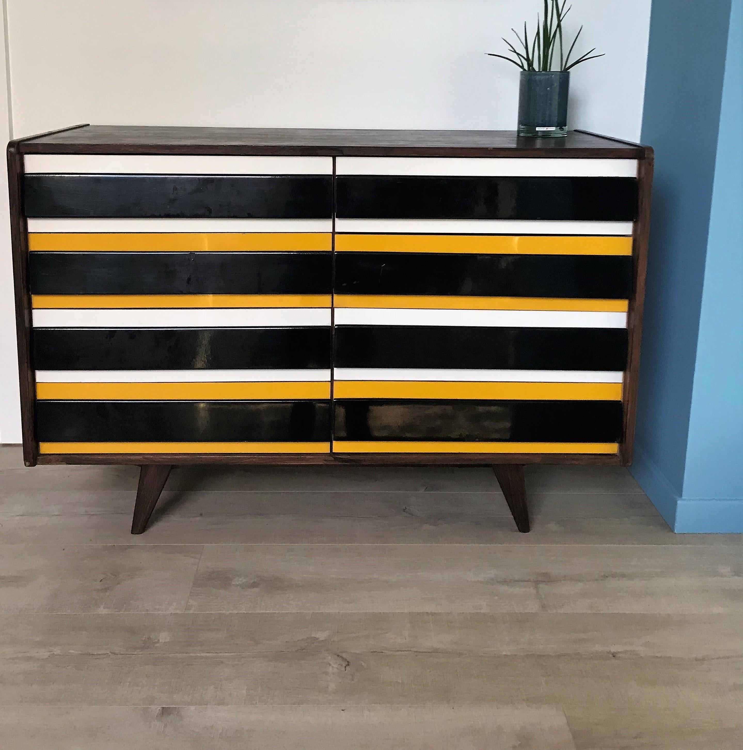 Midcentury cabinet designed by Jiri Jiroutek for interier Praha.

The cabinet features 8 lacquered drawers in yellow, black and white colors.

Labeled at the back.

Good overall condition, some slight signs of wear consistent with age and