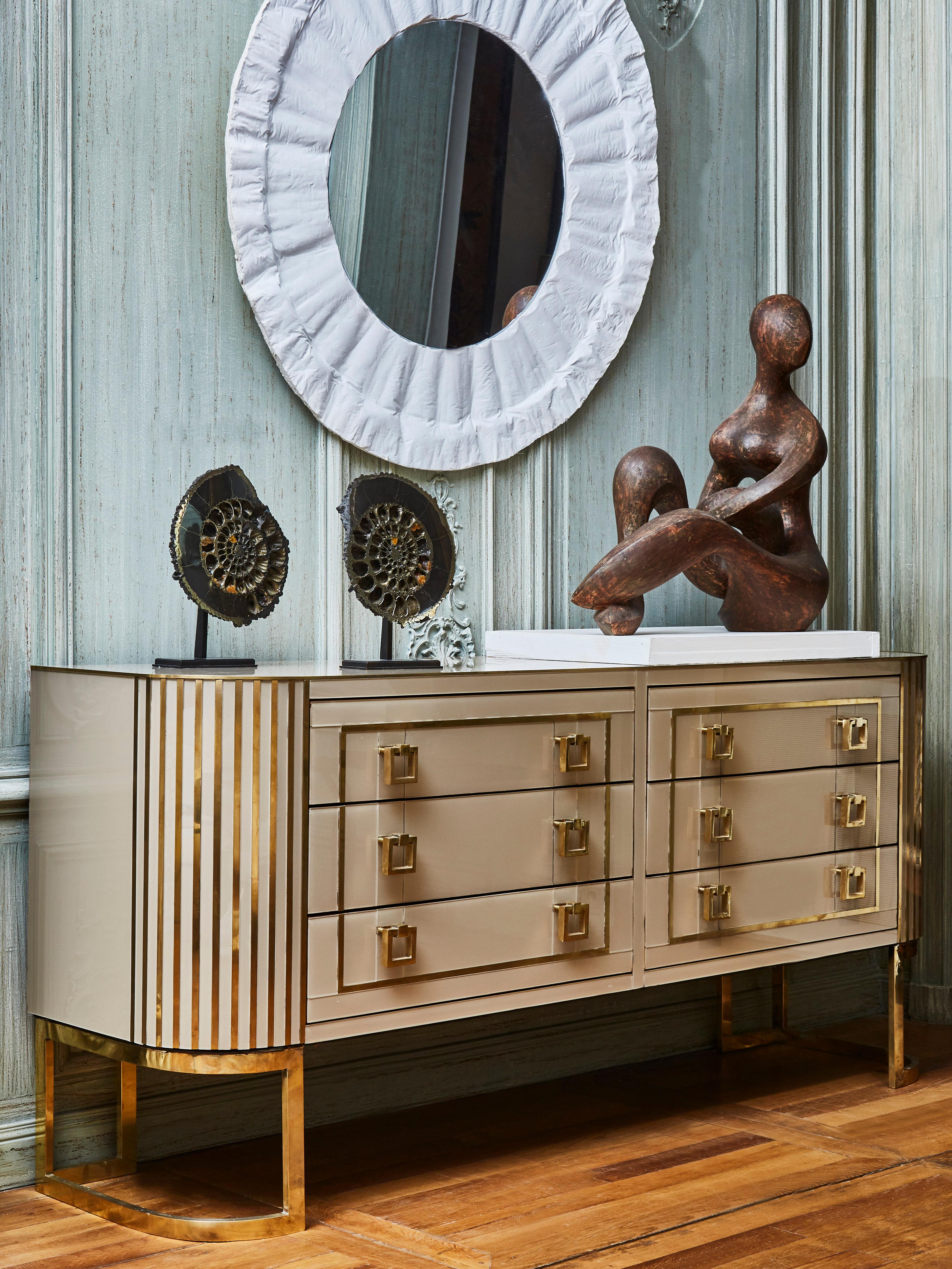 Vintage wooden chest of drawers entirely restored and customized with tainted mirrors and brass inlays. 
2 brass feet. 6 drawers.
Italy, 1970s.