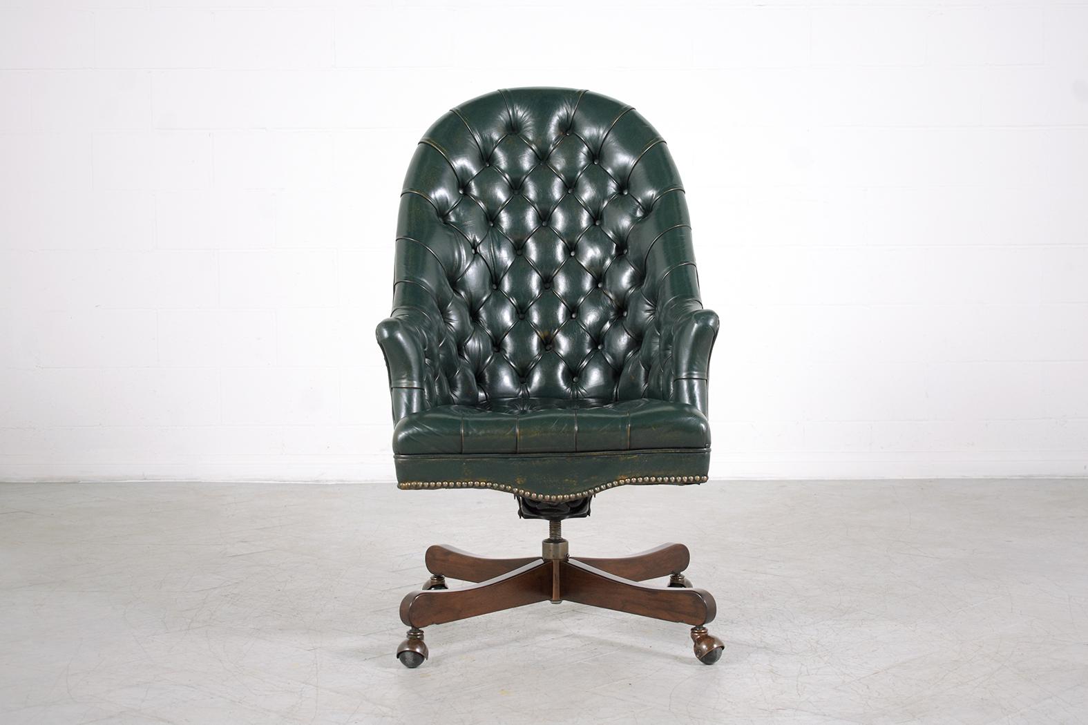 This vintage leather chesterfield swivel office chair is in good condition completely restored by our professional craftsmen team. In this executive office armchair, the frame is hand-crafted out of solid wood and leather combination and this sleek
