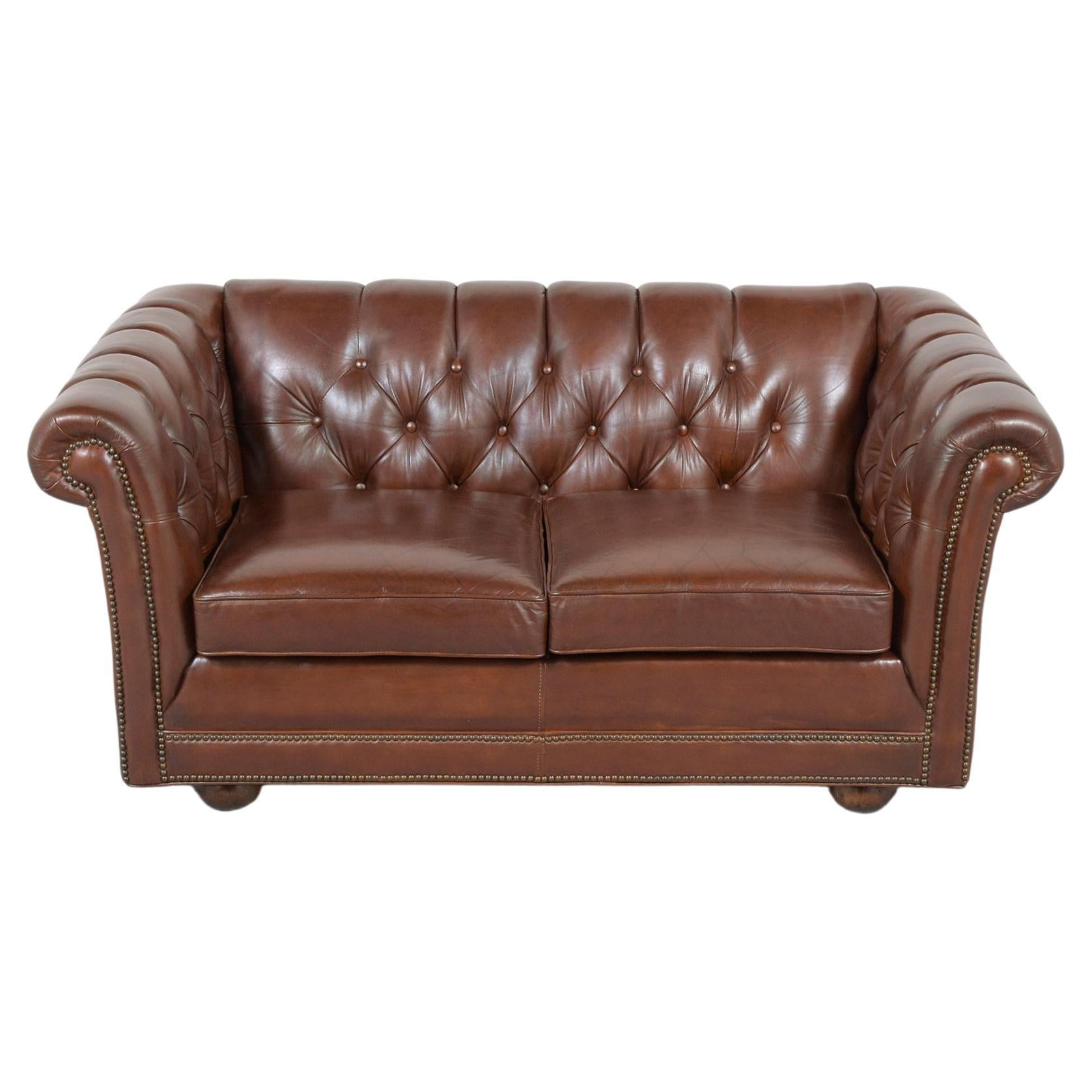 An extraordinary vintage brown leather chesterfield sofa is crafted out of wood and leather combination in great condition and completely restored by our professional craftsmen team. This sofa features the original leather upholstery newly dyed in