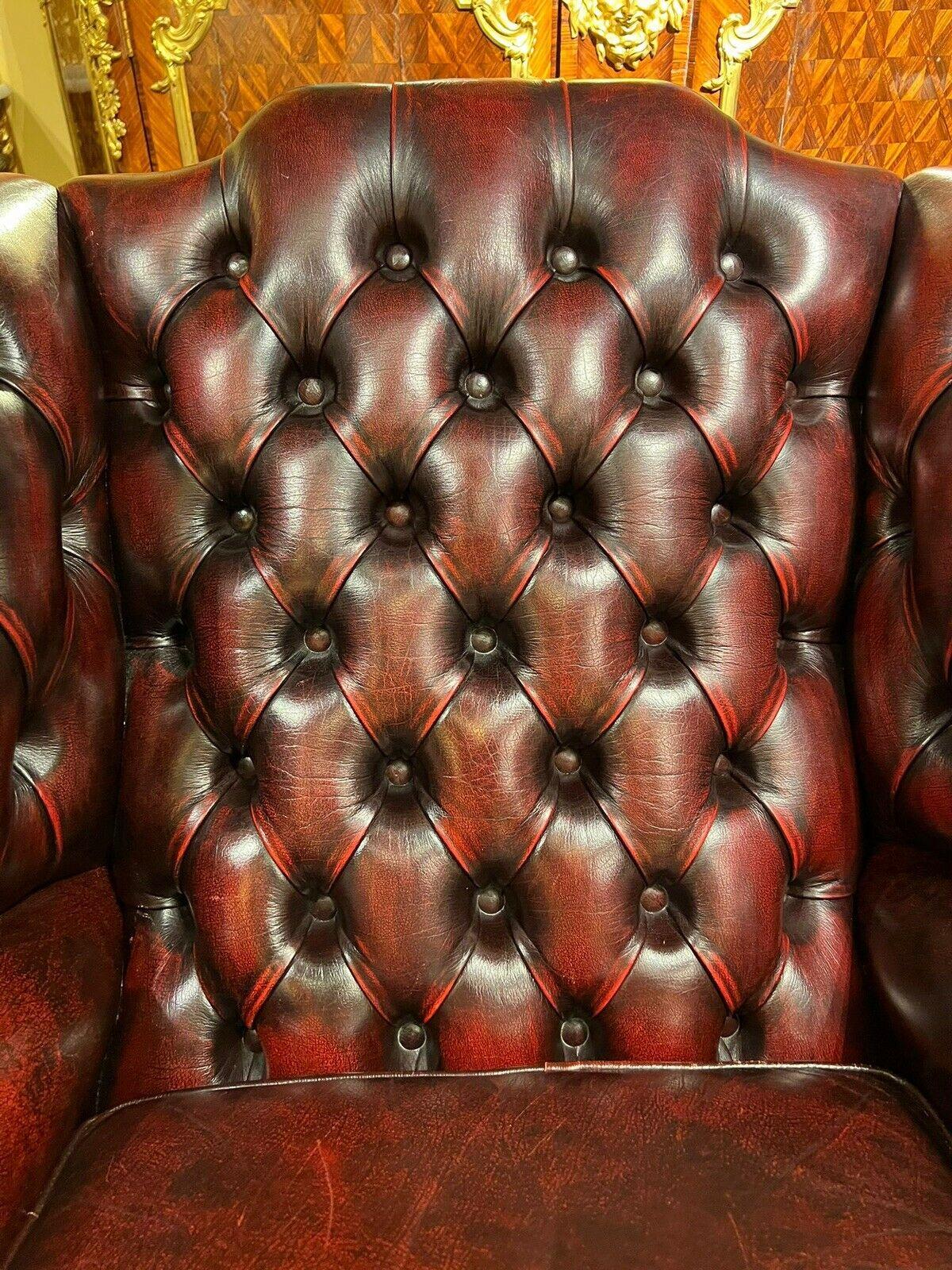 English Vintage original Chesterfield Oxblood Leather Wingback  Armchair and Footstool For Sale