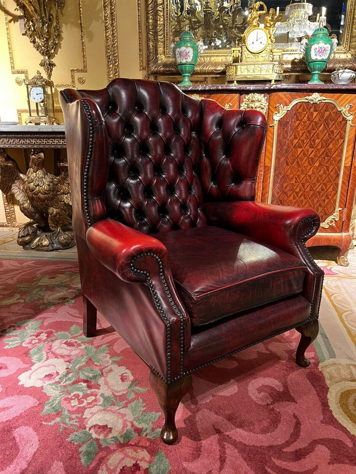 Vintage original Chesterfield Oxblood Leather Wingback  Armchair and Footstool In Good Condition For Sale In Berlin, DE